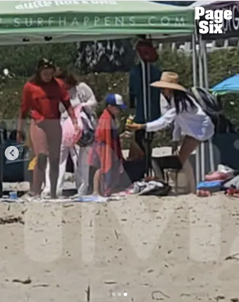 Meghan Markle attends to her son, Prince Archie, while on Santa Claus Beach in California, posted on August 2, 2025. | Source: Instagram/Page Six