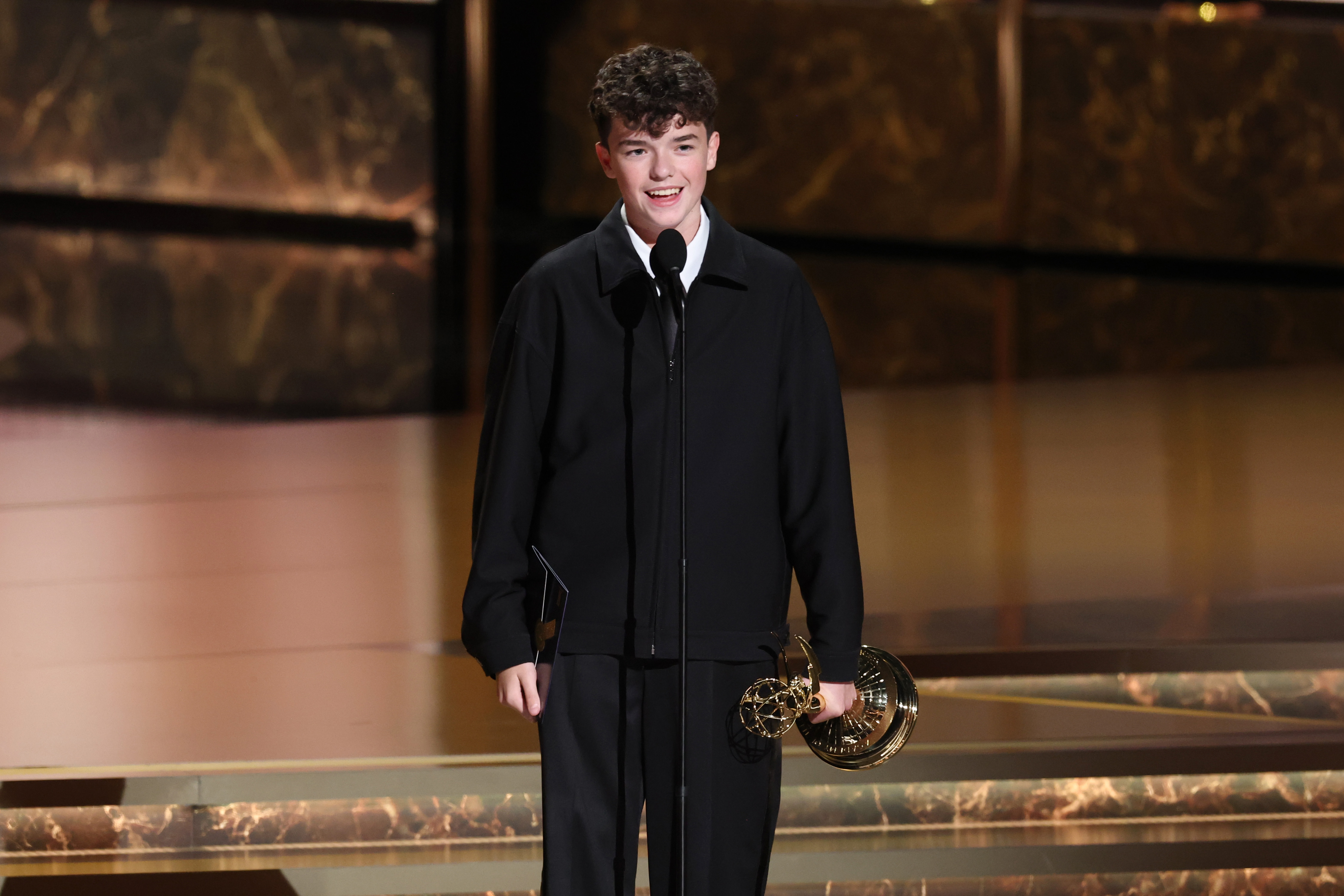 Owen Cooper smiling at the audience during his acceptance speech. | Source: Getty Images