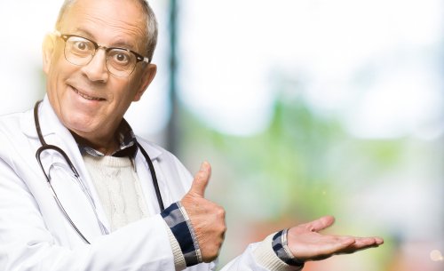 A male doctor showing the thumbs up sign that everything is good. | Source: Shutterstock.