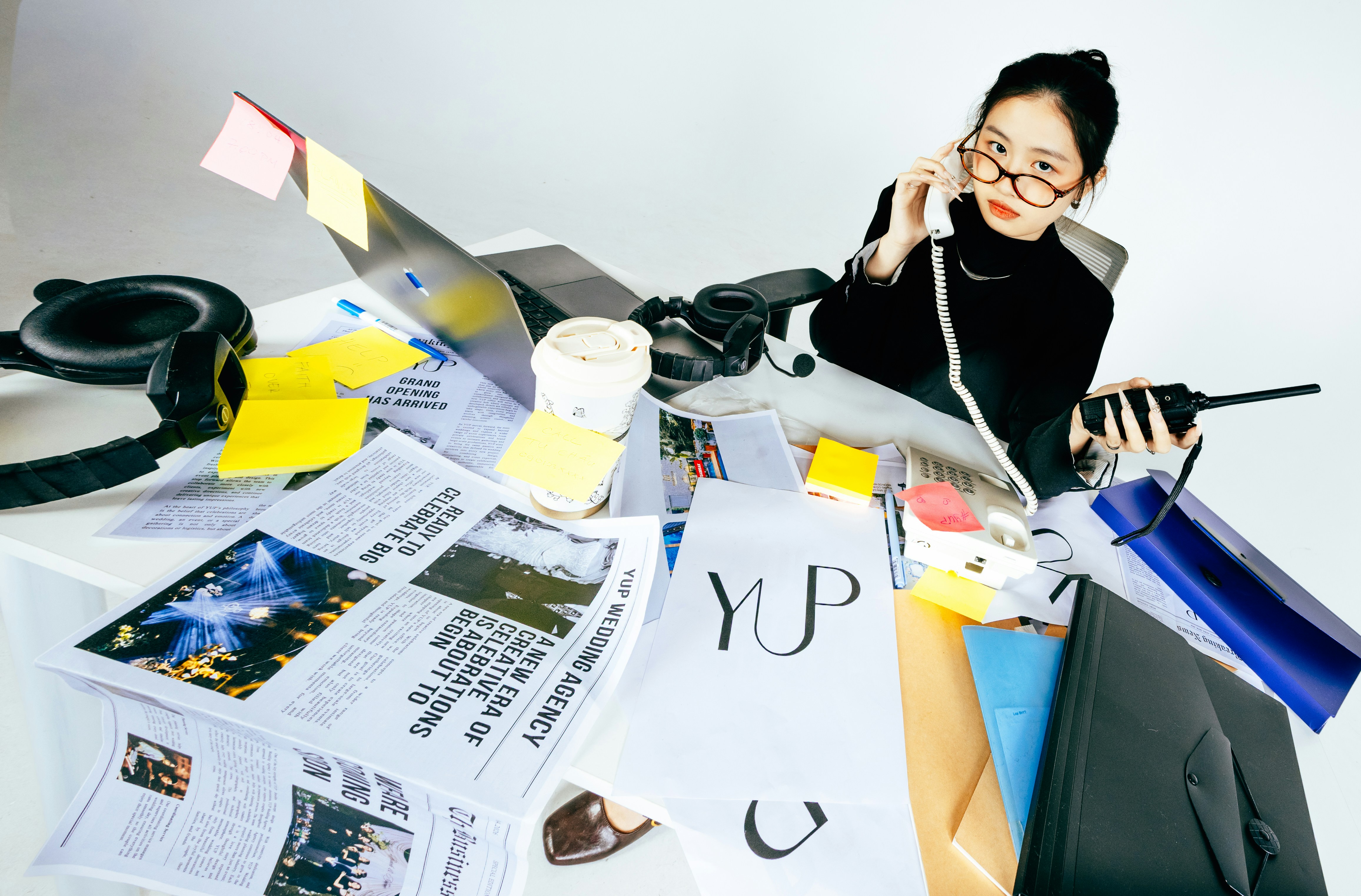 Busy woman with a cluttered desk | Source: Unsplash