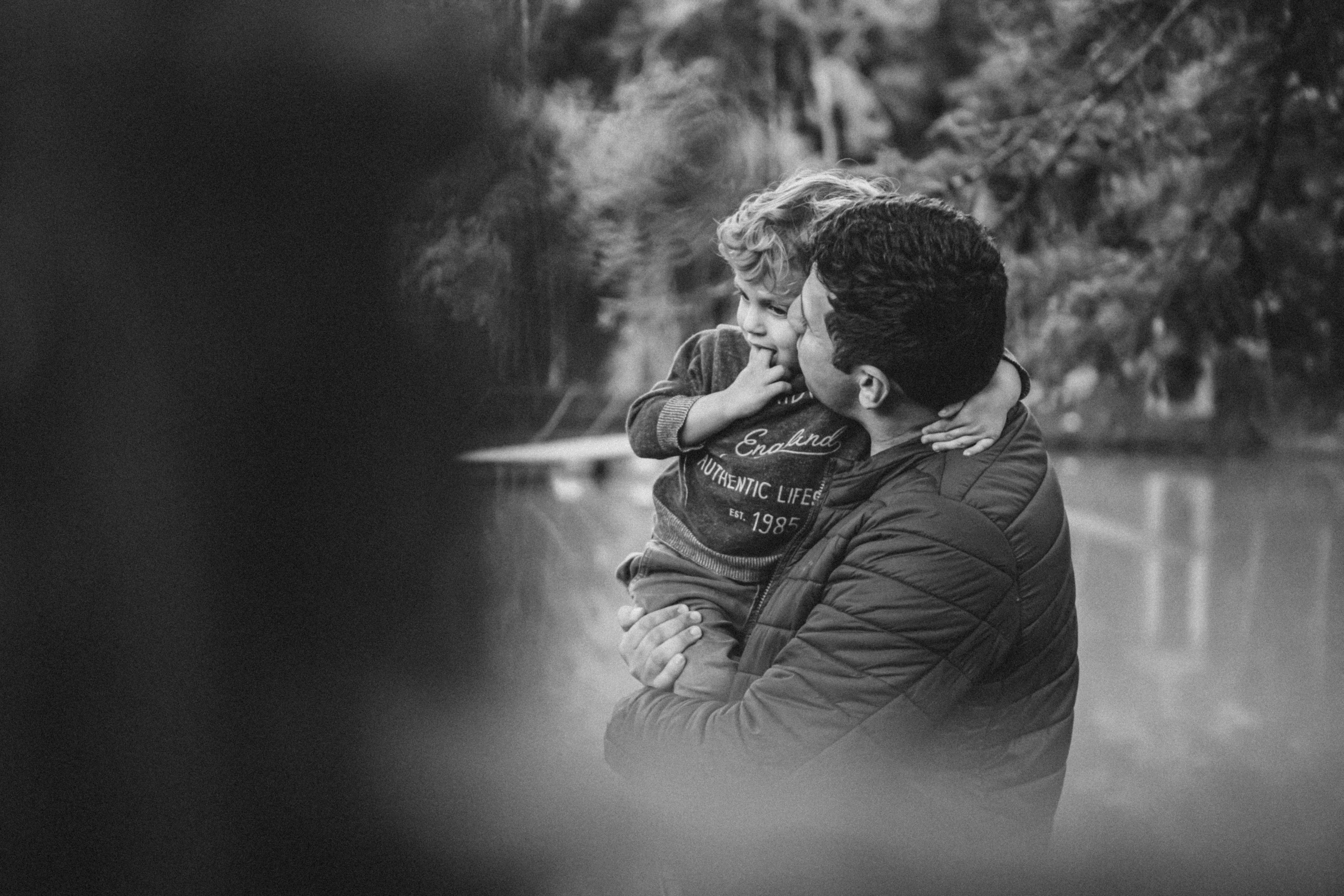 A man holding a small boy in his arms | Source: Pexels