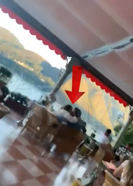 Jennifer Lopez and Ben Affleck sit inside a restaurant facing the lake in Lake Como, Italy, posted on August 24, 2022 | Source: YouTube/TMZ