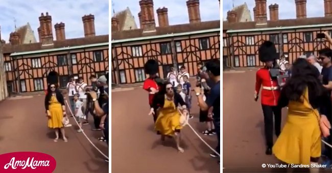 Moment when Queen's Guard rudely pushed lady tourist out of his way
