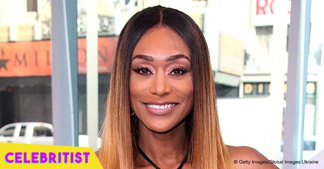 Tami Roman puts cleavage on display in low-cut mini-dress after significant weight loss