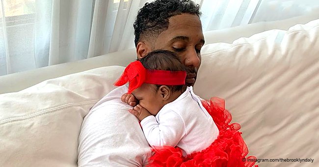 Kenya Moore's baby steals hearts in red tutu & matching bow, resting on her 'Valentine' in new pic