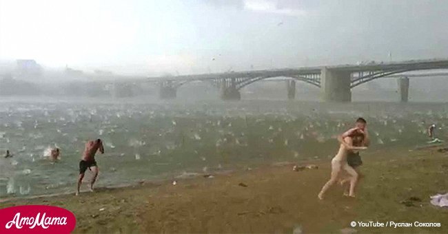 It was an ordinary summer day until heavy hail storm rains down on beach