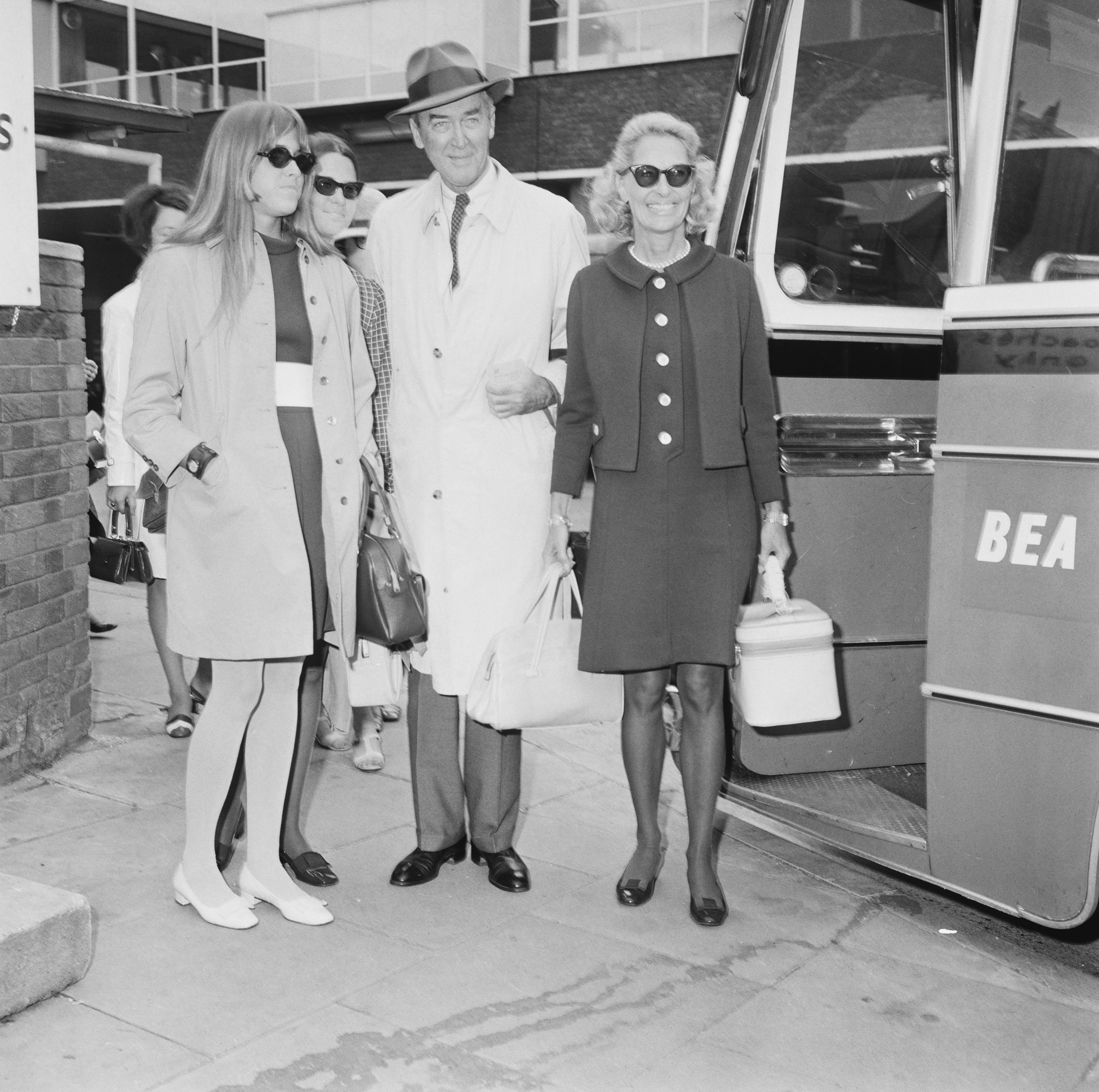 James Stewart, Gloria Hatrick McLean, and daughters Judy and Kelly at Heathrow Airport, London on July 2, 1968 | Source: Getty Images