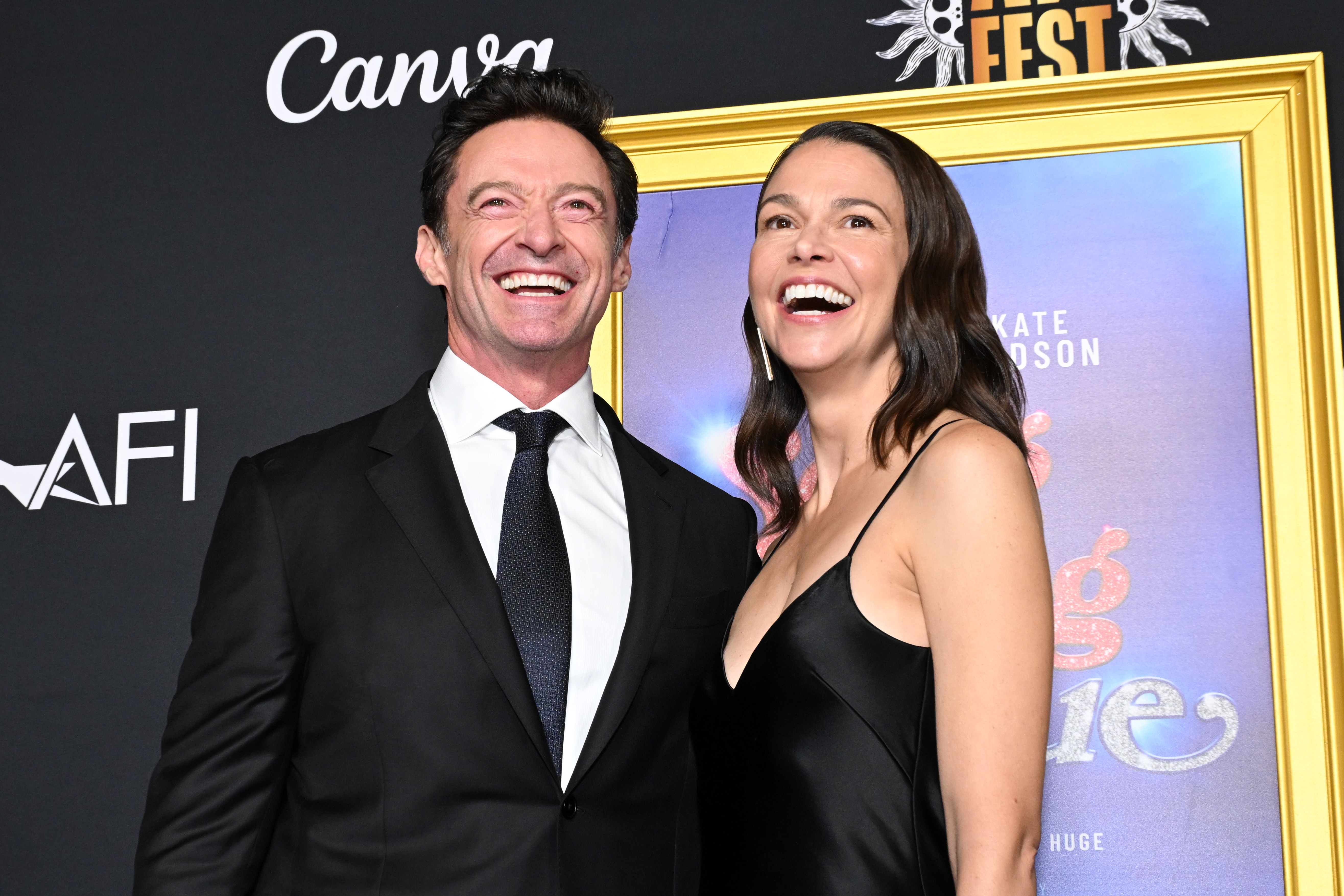 Hugh Jackman and Sutton Foster smile while attending the closing night gala premiere of "Song Sung Blue" on October 26, 2025, in Hollywood, California. | Source: Getty Images
