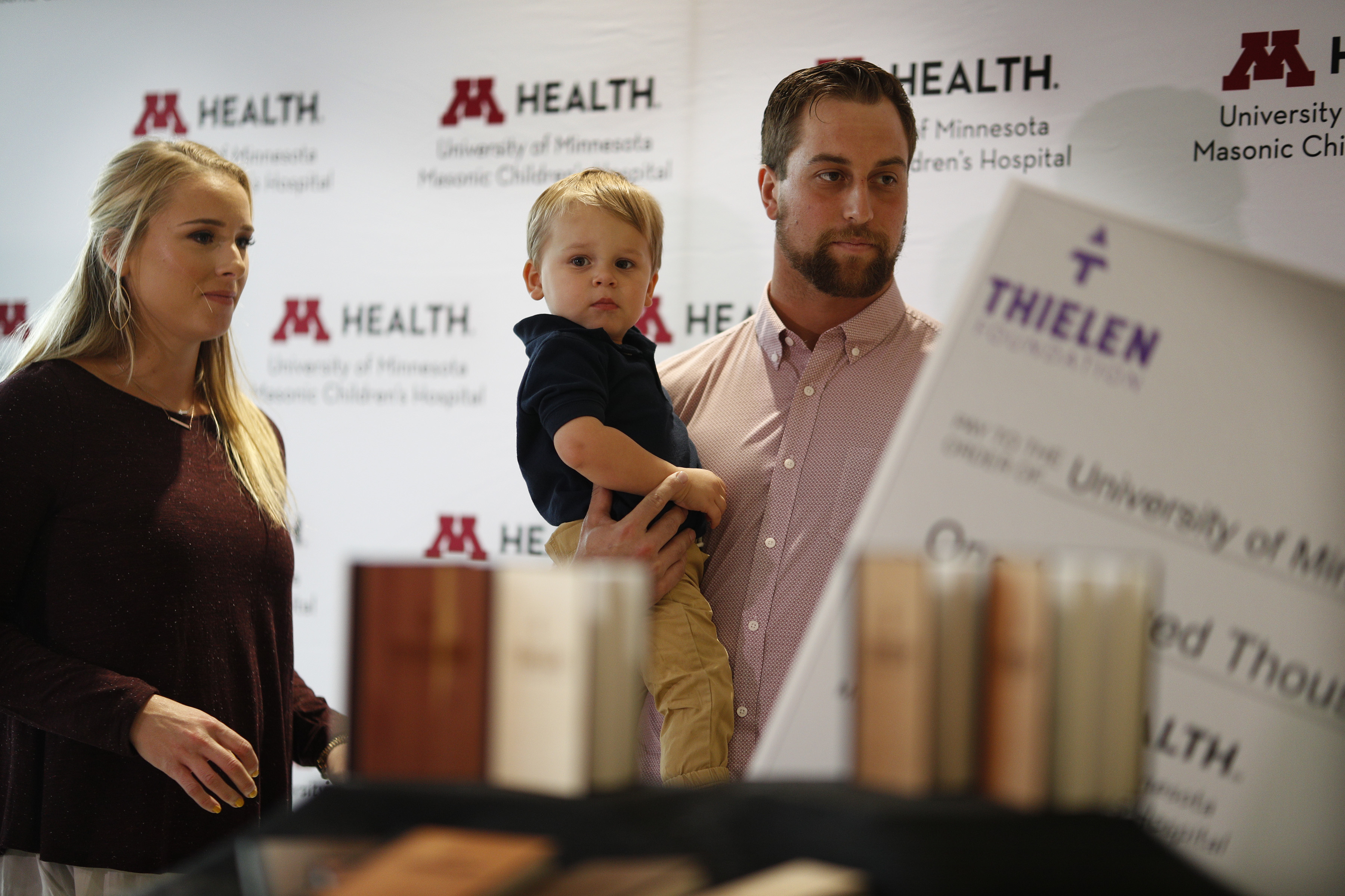 Adam, Caitlin and Asher Thielen, announced that they would be starting the Thielen Foundation partnering with the U of M Masonic Children's Hospital on Tuesday, September 18, 2018, in Minneapolis | Source: Getty Images