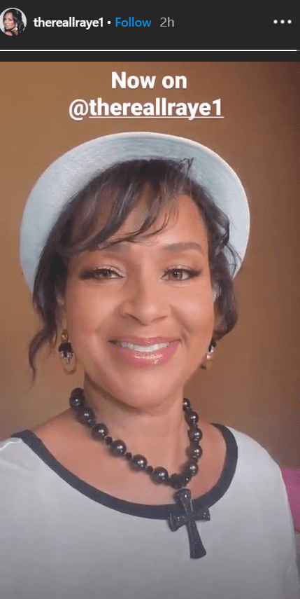 LisaRaye McCoy shows off her dazzling smile in a white outfit and hat | Photo: Instagram/thereallraye1