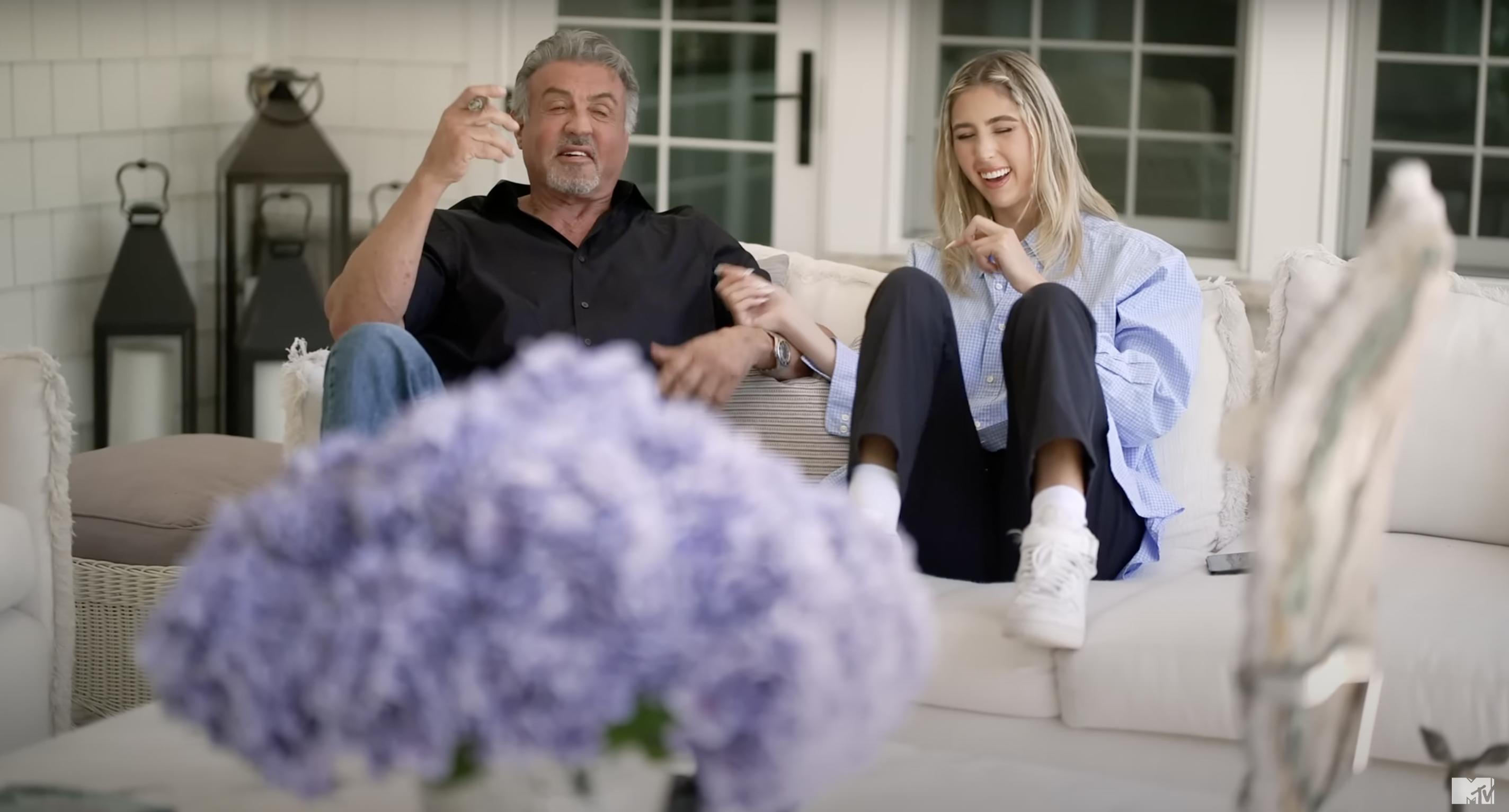 Sylvester Stallone with one of his daughters in their home as seen in a video dated February 12, 2024 | Source: YouTube/@mtvreality