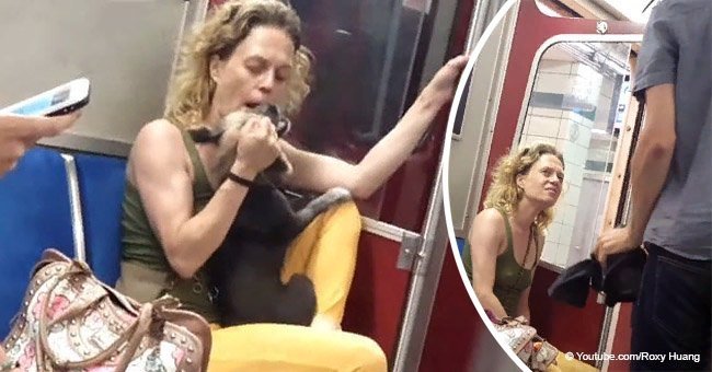 Woman repeatedly hits her dog on subway as passengers try to stop her