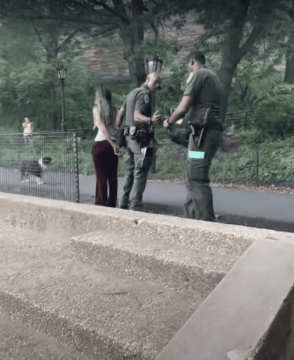 Dora Marchand being handcuffed by New York park officers. | Source: youtube.com/WestSideRag