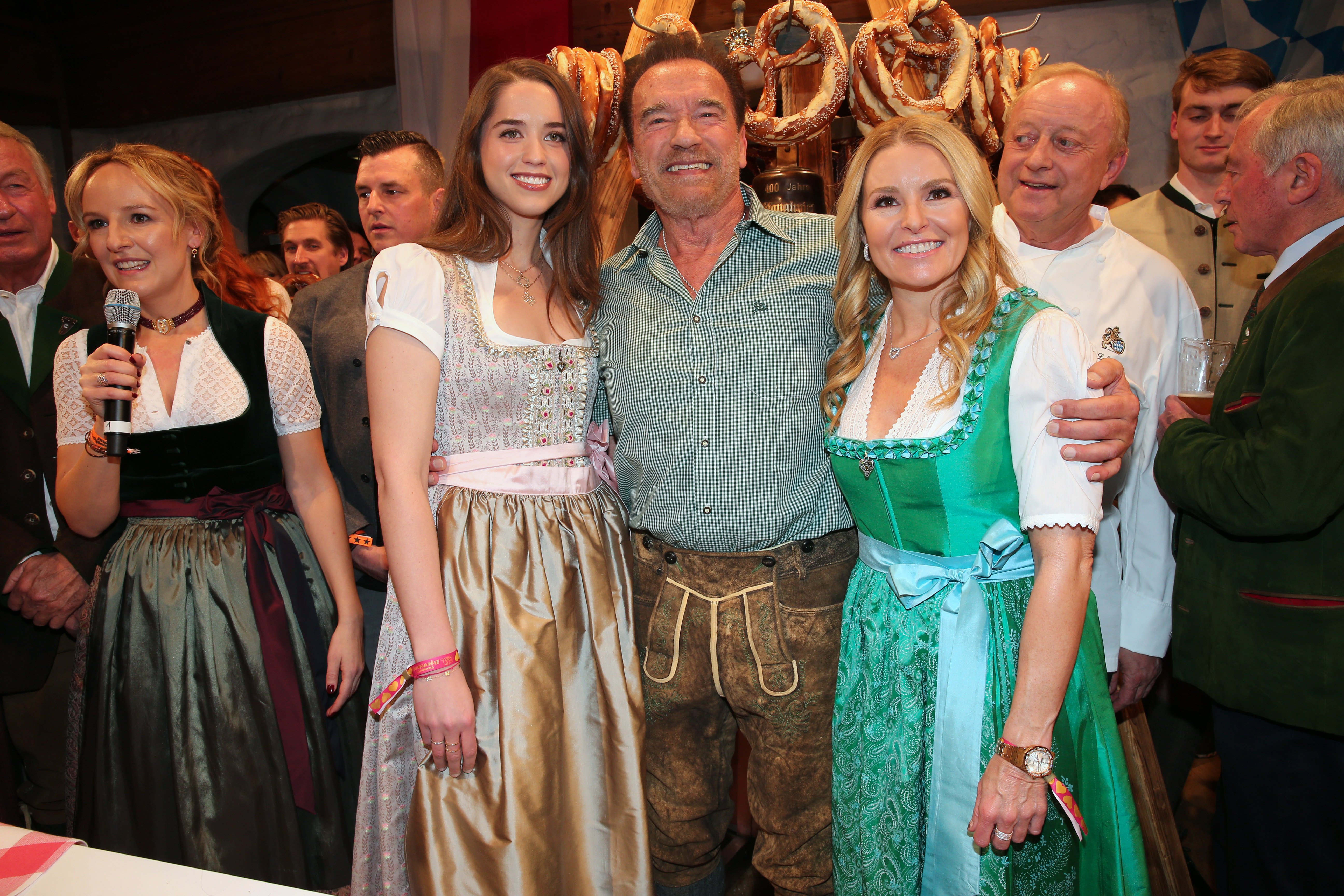 Christina Schwarzenegger with Arnold Schwarzenegger and his girlfriend Heather Milligan at the 29th Weisswurstparty hosted at Hotel Stanglwirt near Kitzuehel, Austria, on January 24, 2020. | Source: Getty Images.