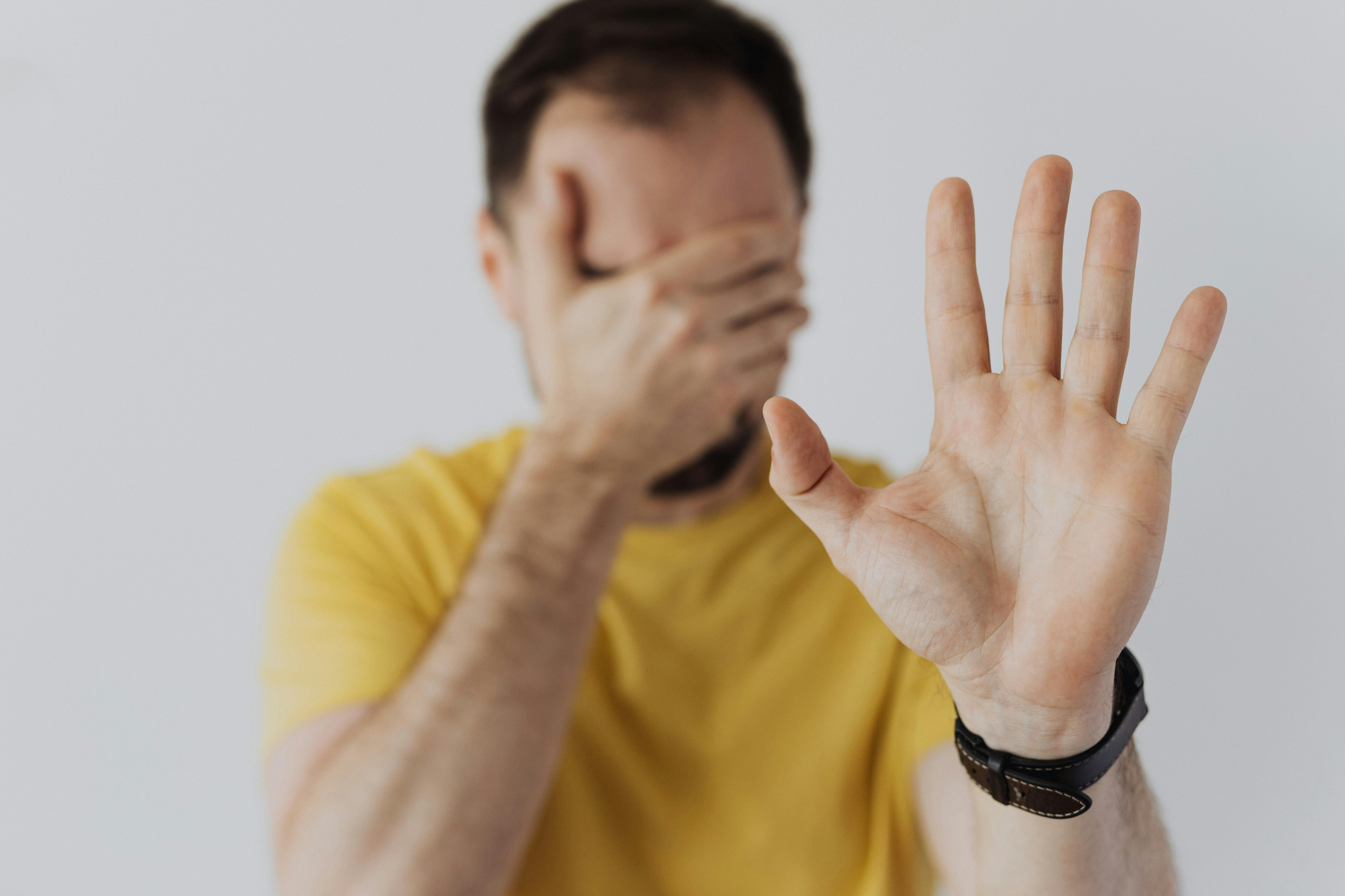 A man showing his palm, indicating "stop" | Source: Pexels