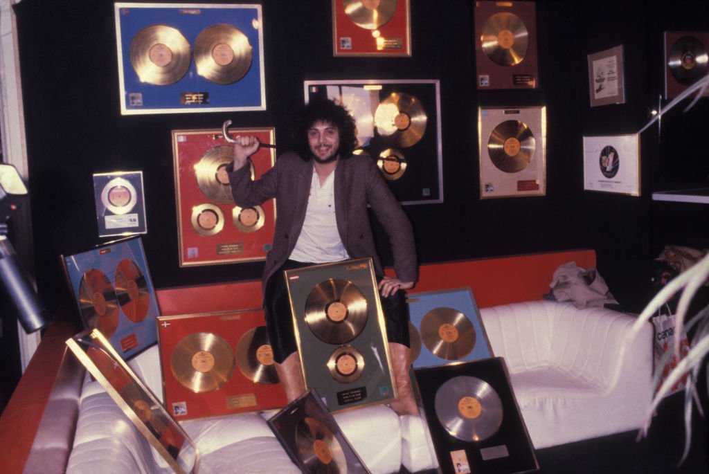 Singer Patrick Hernandez was surrounded by MIDEM gold records on January 26, 1980 in Cannes, France.  І Source: Getty Images