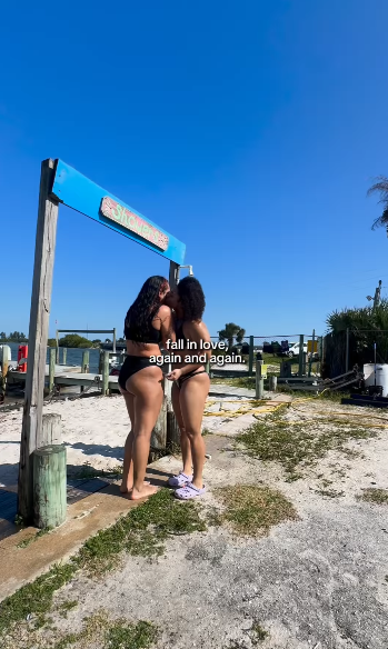 Simone Johnson and Tatyanna Dumas kissing at the beach, from a post dated December 7, 2025 | Source: Instagram/bigupsofficial