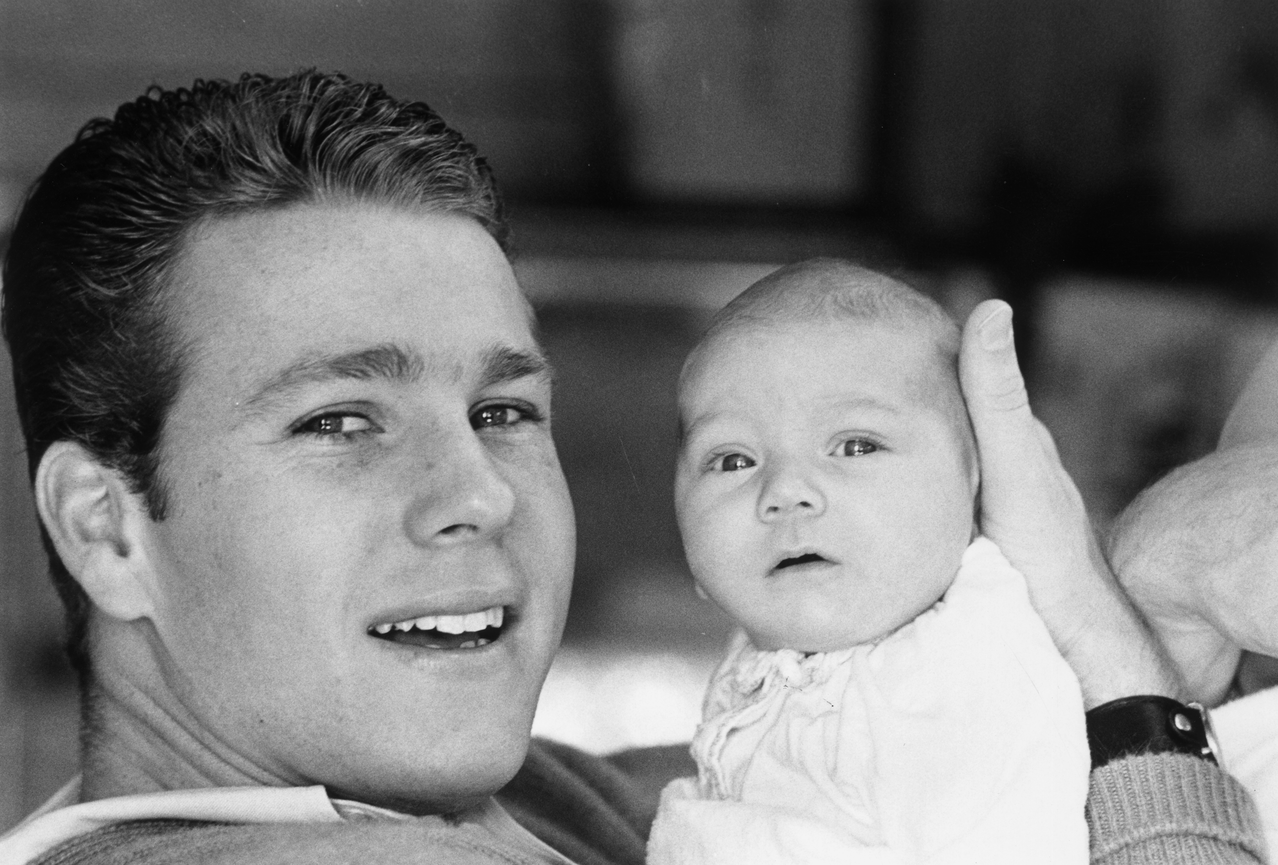 Ryan O'Neal and his son Griffin in 1965 | Source: Getty Images