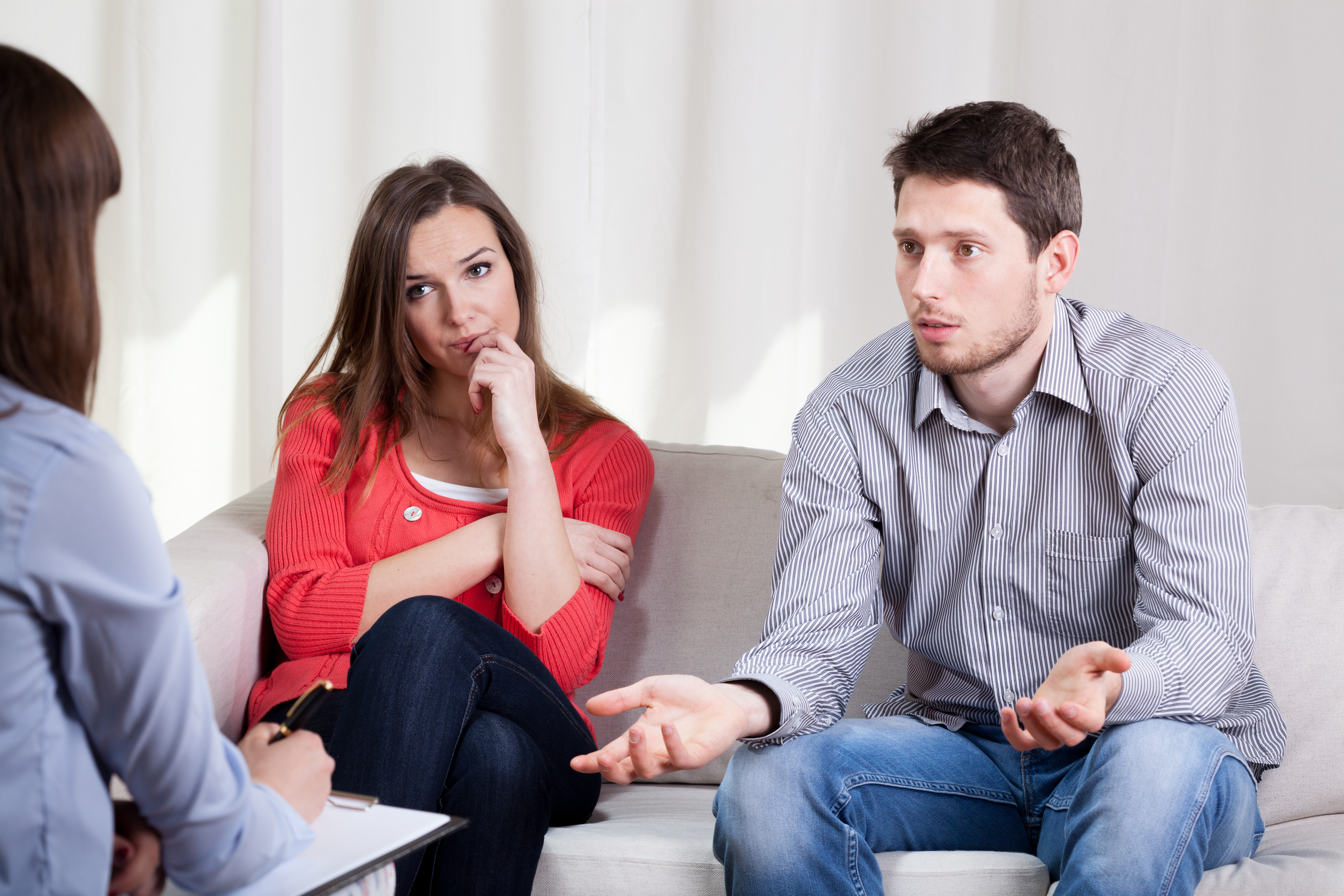 Sad couple is talking to woman | Source: Shutterstock.com