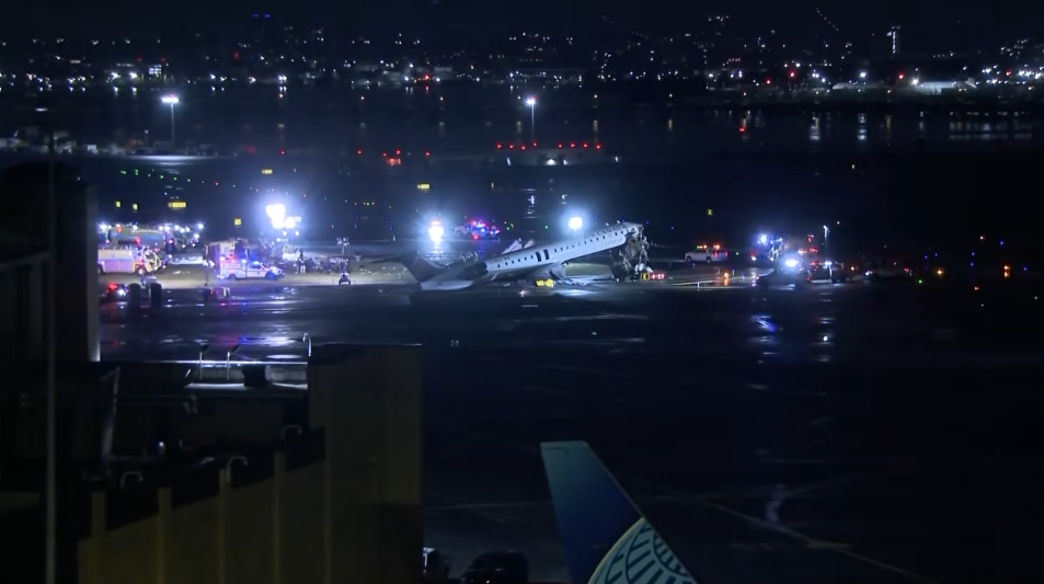 Emergency personnel around the tarmac after an An Air Canada Express plane colliding with a fire truck at LaGuardia Airport on March 23, 2026, in New York City | Source: YouTube/KHOU 11