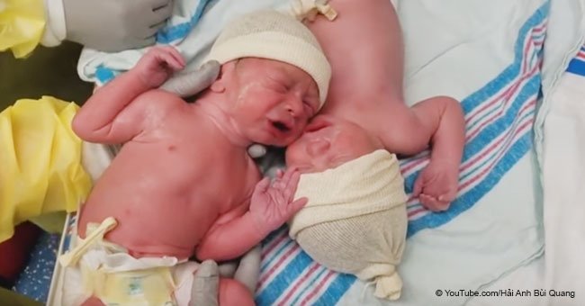 Newborn twins forced to put them back together again with heartbreaking crying