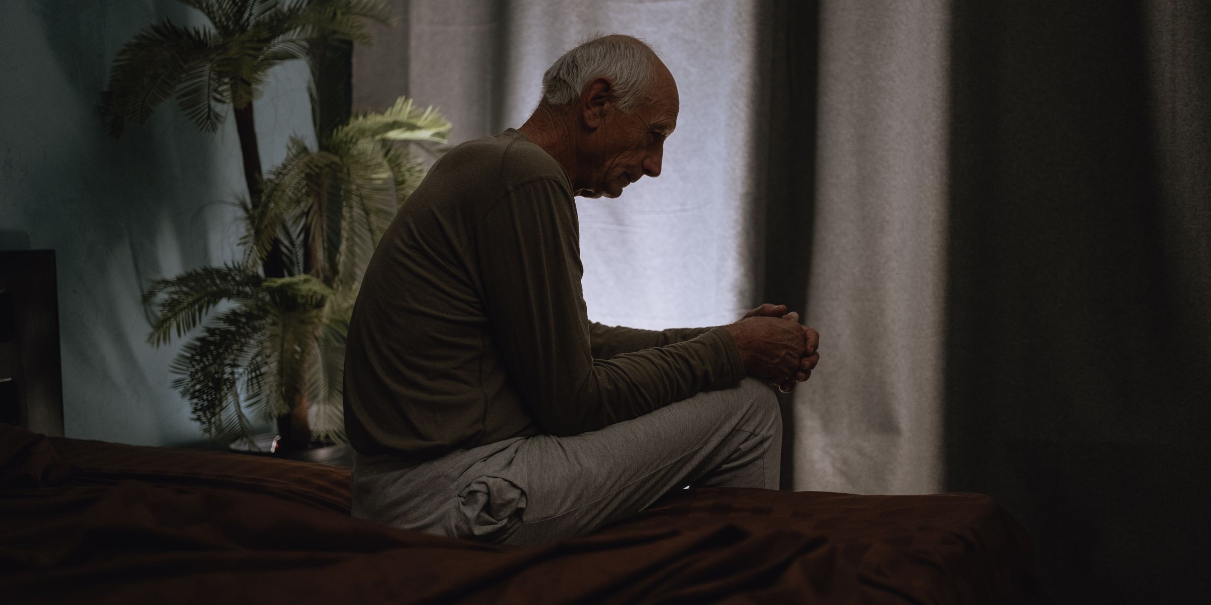 An old miserable man sitting alone | Source: Shutterstock