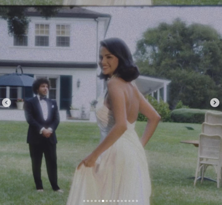 Selena Gomez smiles as Benny Blanco looks on in the background during their wedding celebration, as posted on September 27, 2025 | Source: Instagram/selenagomez