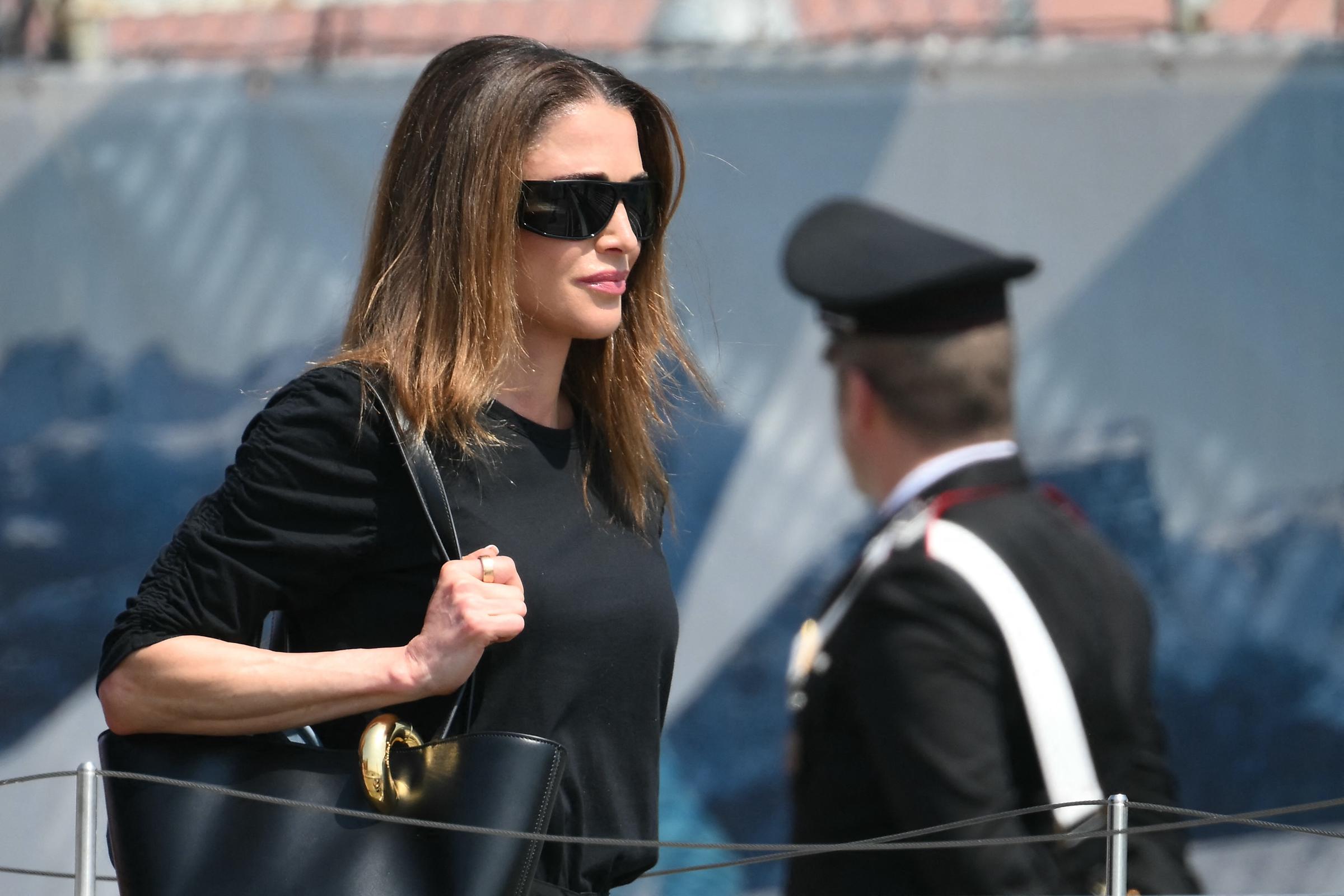 Jordan's Queen Rania prepares to board a taxi boat after landing at Venice Marco Polo airport ahead of the wedding.