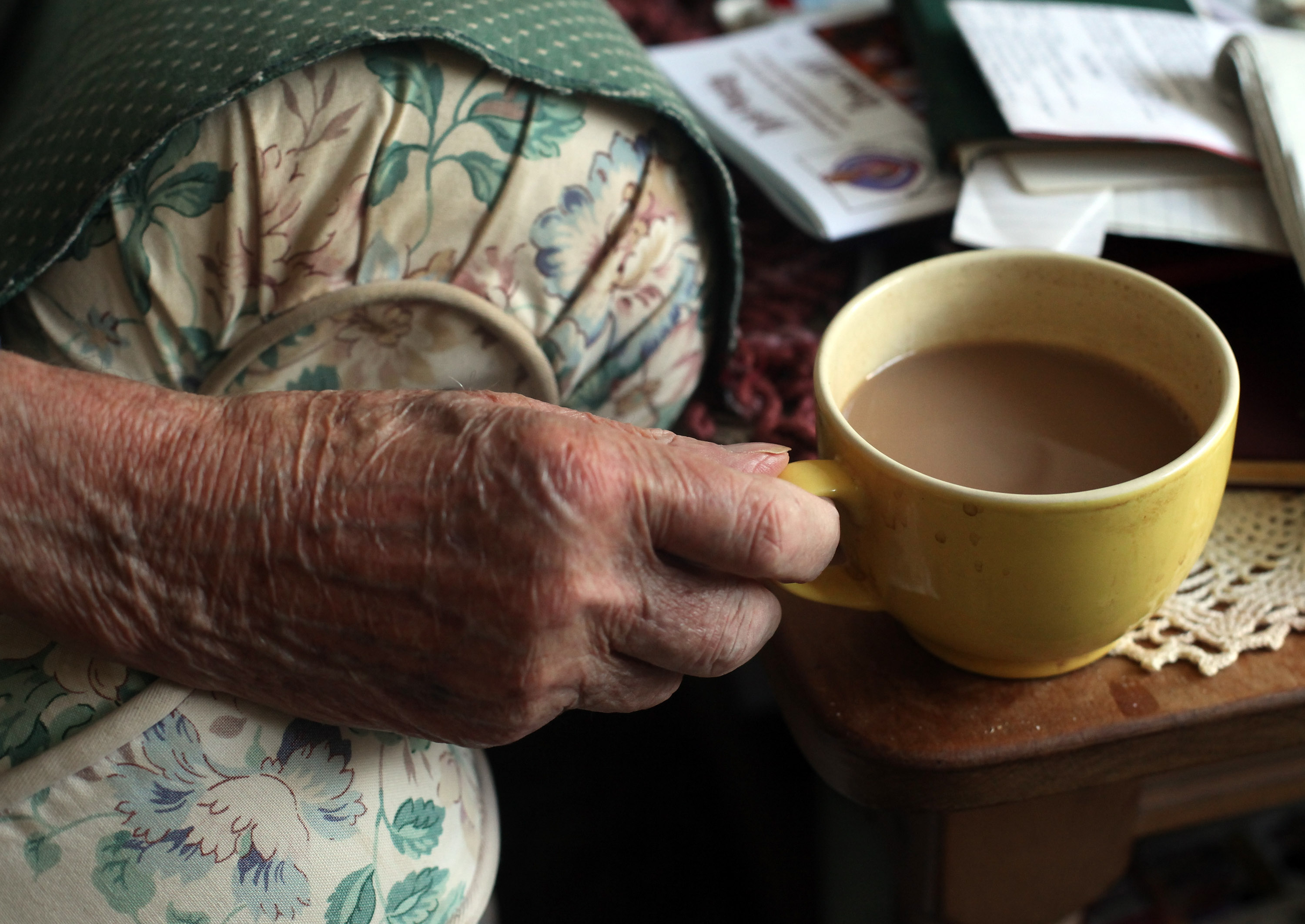 An elderly woman holding a cup of coffee | Source: Getty Images