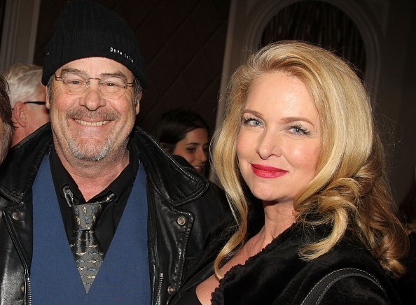 Dan Aykroyd and wife Donna Dixon pose backstage at the hit play "It;s Only a Play" on February 12, 2015 | Photo: Getty Images