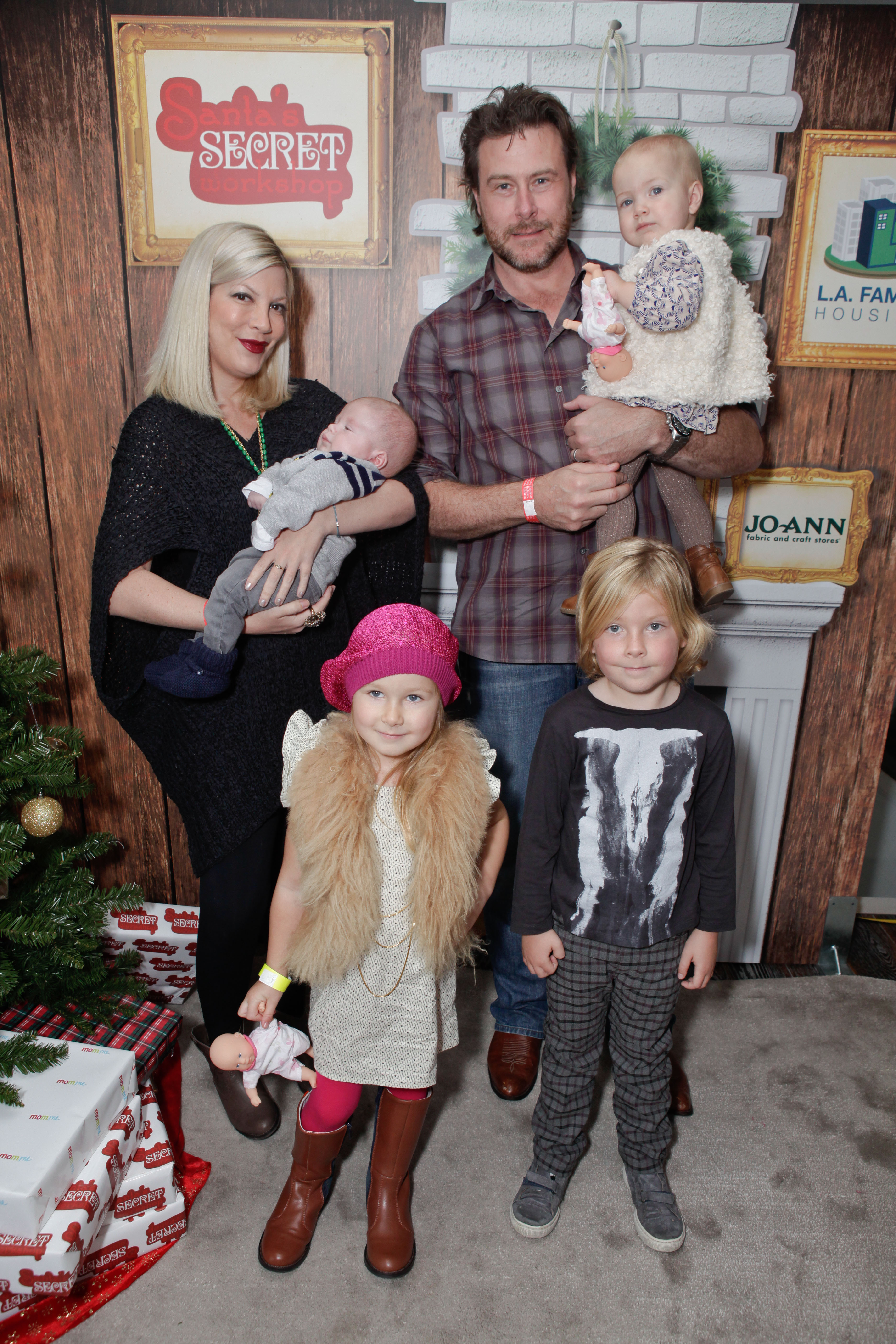 Tori Spelling holding her son Finn alongside her husband Dean McDermott and their kids, Hattie, Stella and Liam attend the 2nd Annual Santa's Secret Workshop Benefiting L.A. Family Housing at Andaz on December 1, 2012 in West Hollywood, California | Source: Getty Images