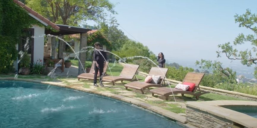 The pool area of John Stamos's Beverly Hills home. | Photo: YouTube/Architectural Digest