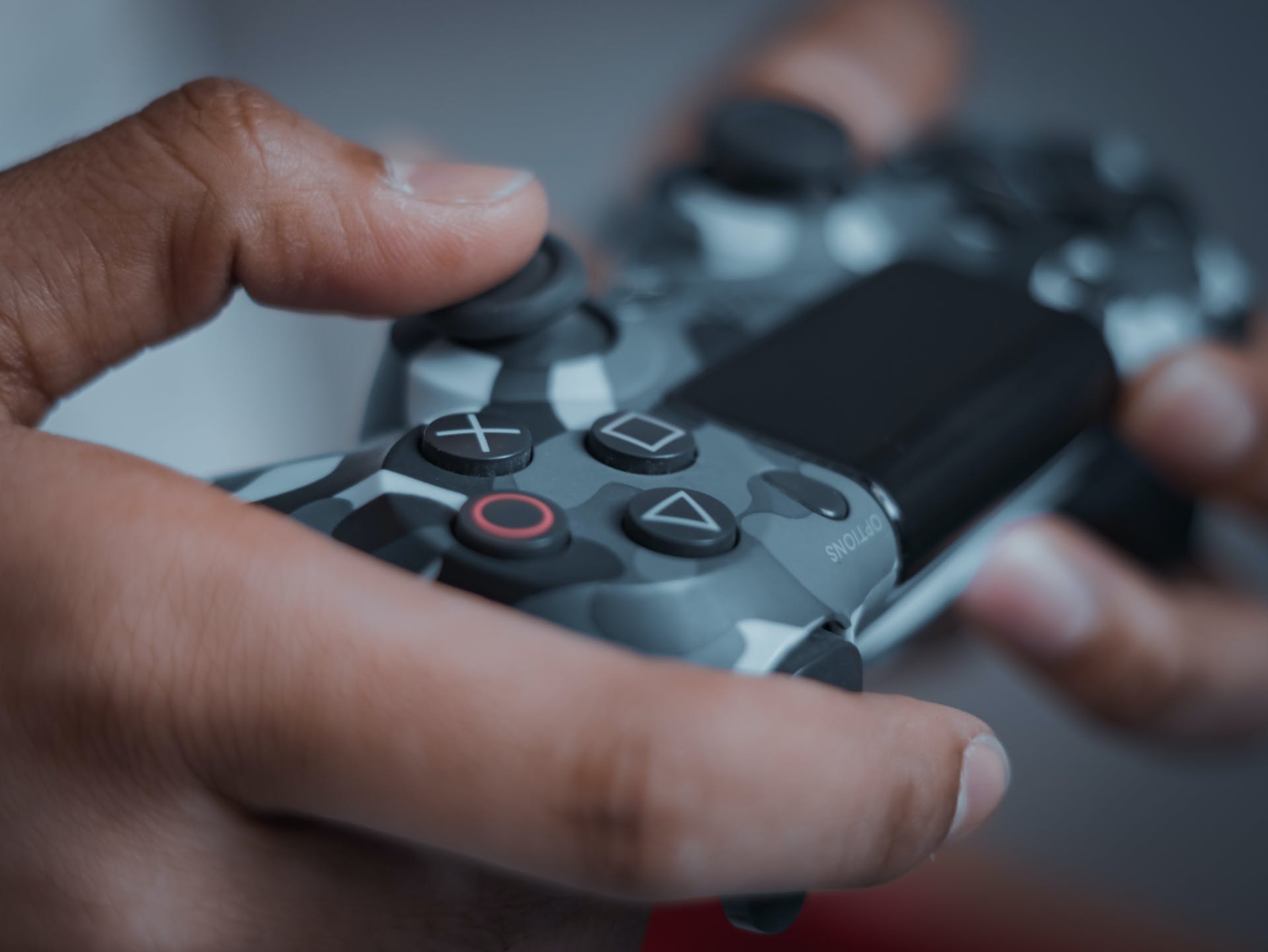 Person holding a gaming controller | Source: Pexels