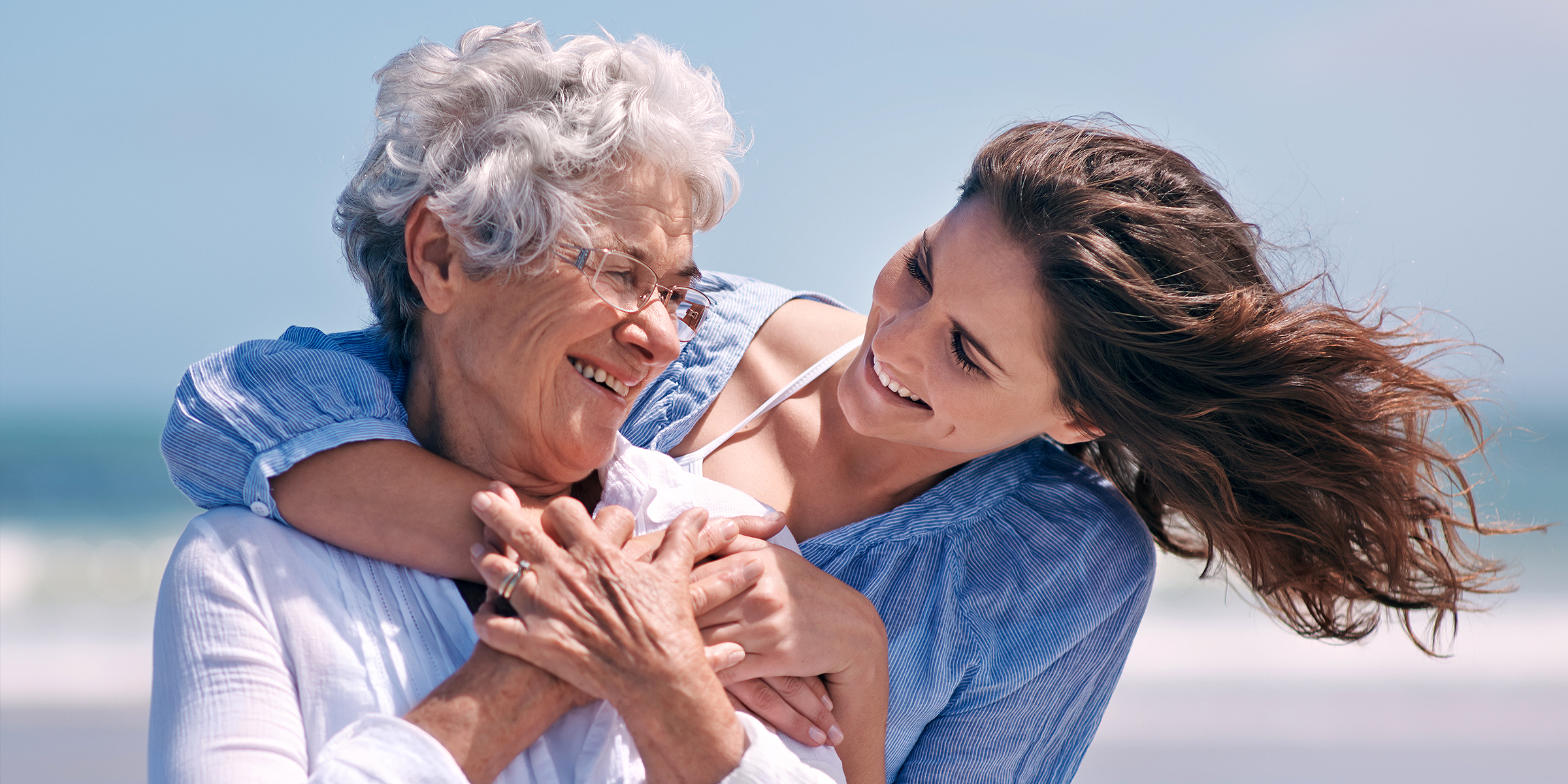 A woman hugging her mother | Source: Shutterstock