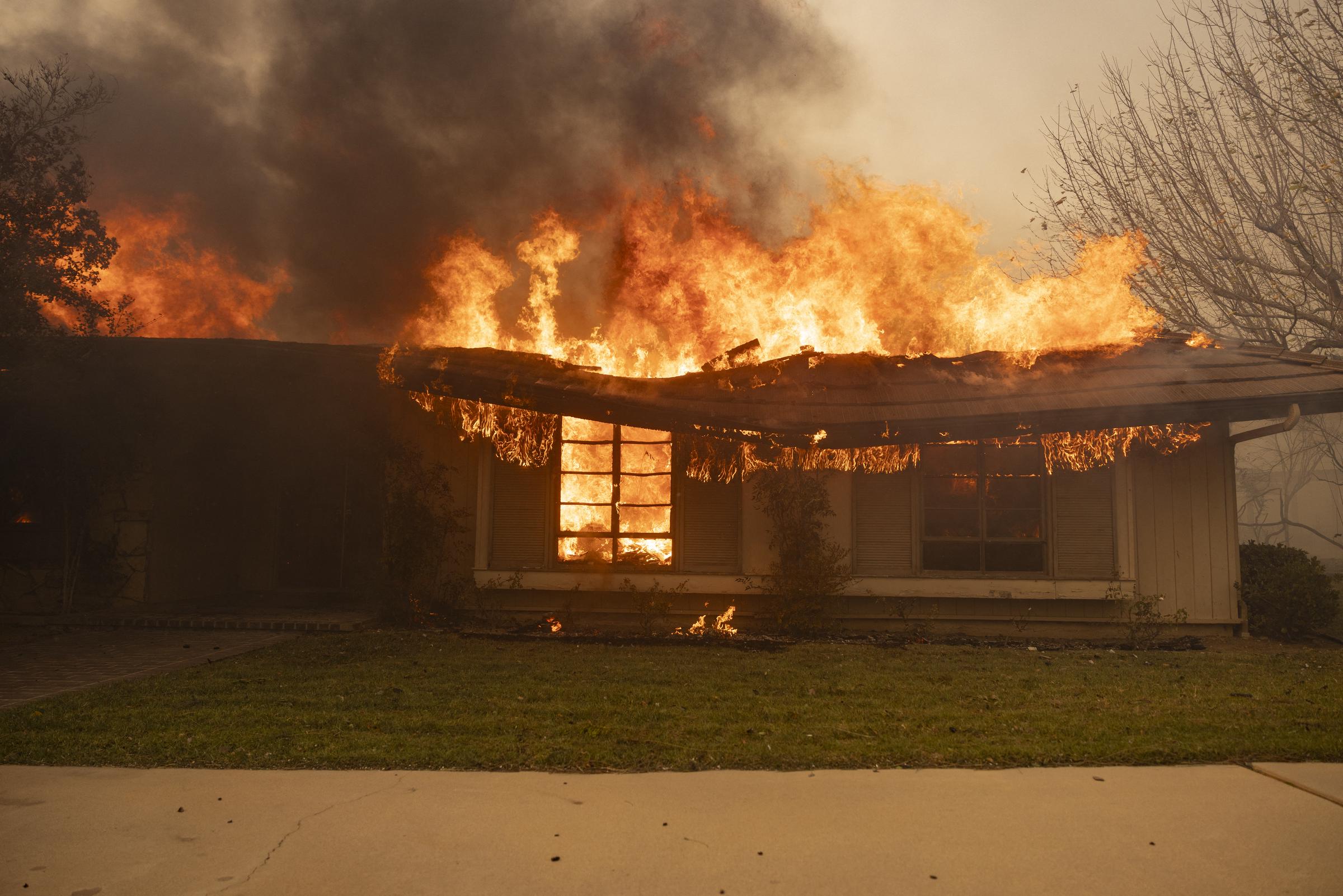 A house engulfed by flames from the Mountain Fire in Camarillo, California on November 6, 2024 | Source: Getty Images