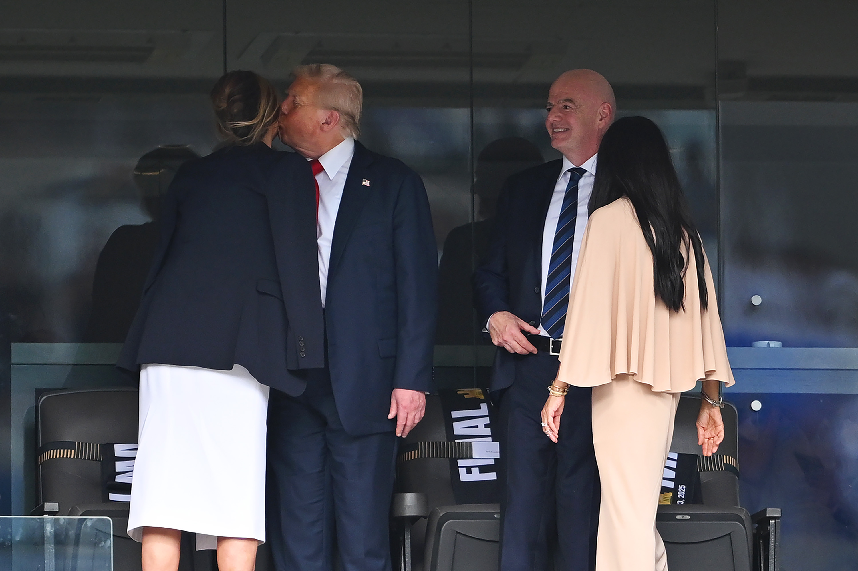 Donald Trump planting a kiss on Melania Trump's cheek during the FIFA Club World Cup Final on July 13, 2025. | Source: Getty Images