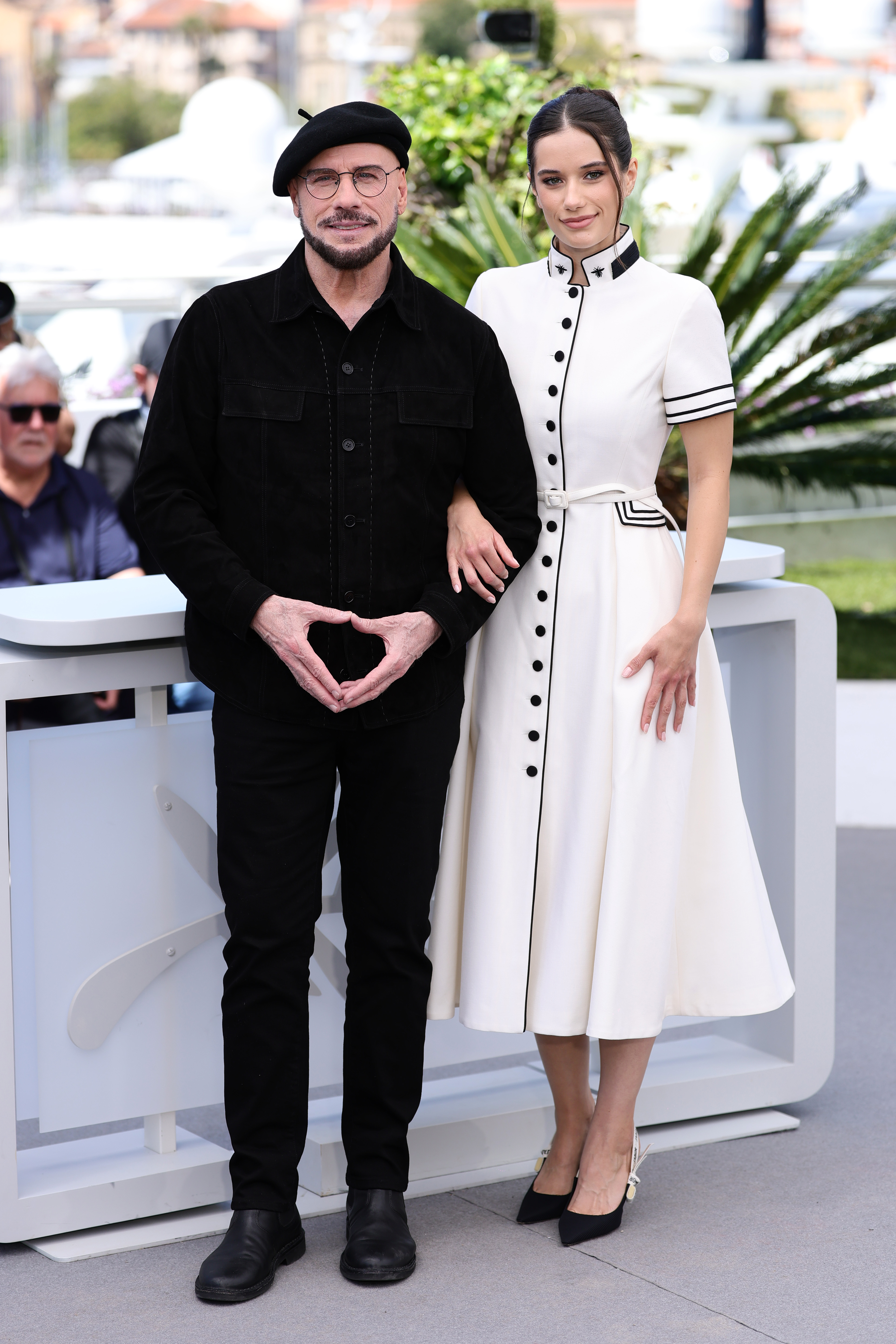 John and Ella Bleu Travolta attend the Official Cannes Film Festival Photocall for the Apple Original Film "Propeller One-Way Night Coach" at the rooftop of the Palais des Festival on May 16, 2026 in Cannes, France. | Source: Getty Images