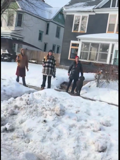 By-standers observing the encounter, from a video post dated January 9, 2026. | Source: YouTube/FoxNews