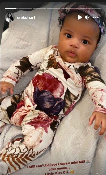 Kevin Hart's daughter, Kaori, staring at the camera dressed up in a onesie | Photo: Instagram/enikohart