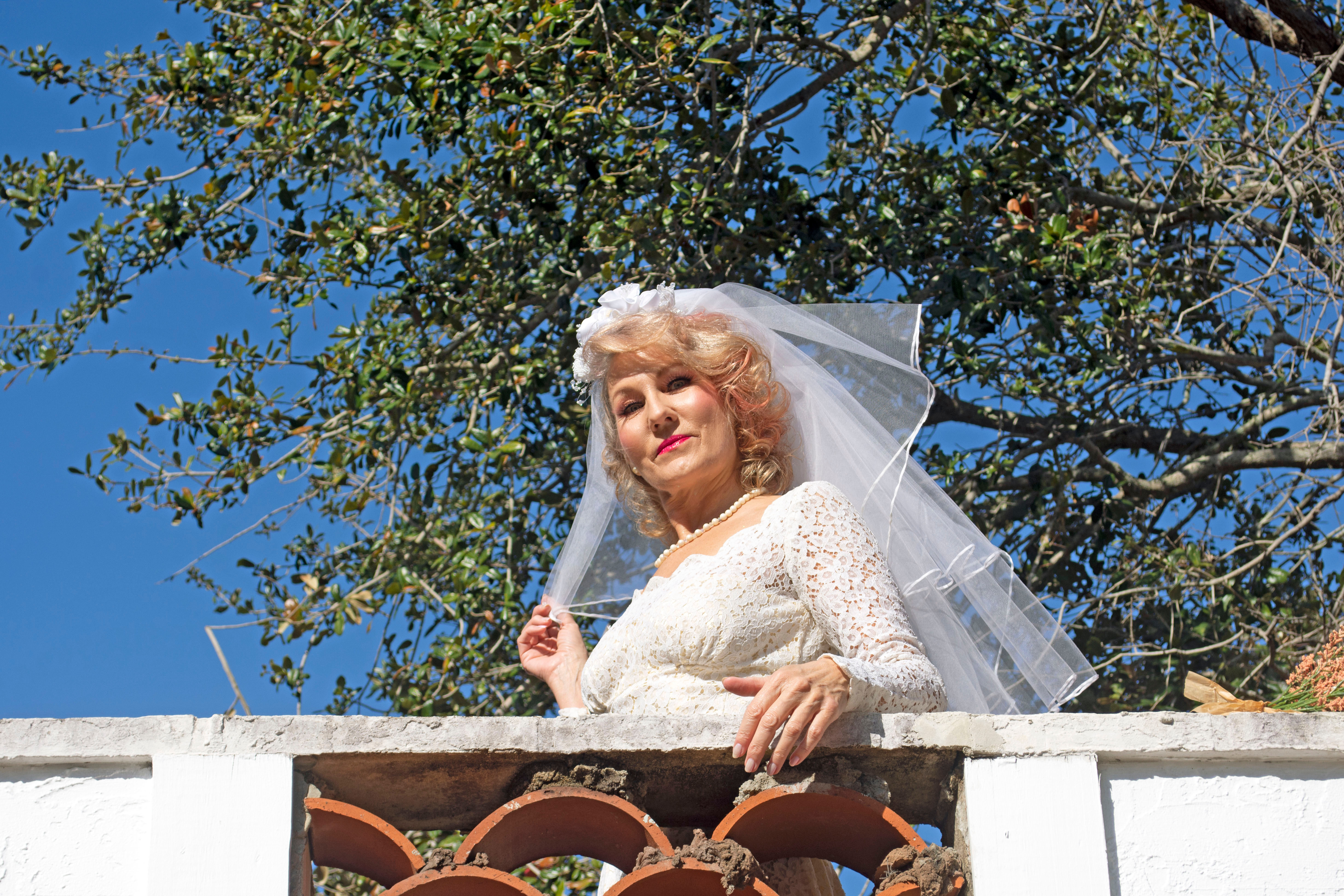 Older woman wearing wedding dress | Source: Shutterstock