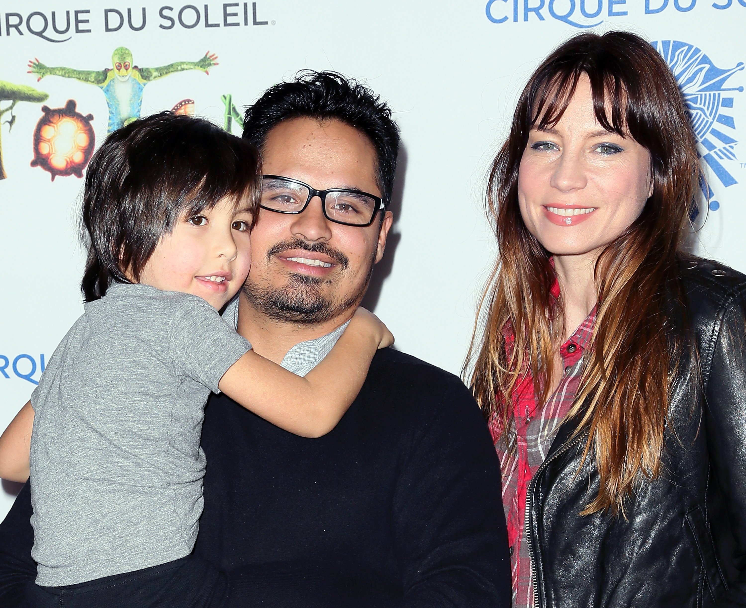 (L-R) Roman Pena, actor Michael Pena and his wife Brie Shaffer attend opening night of Cirque du Soleil's "Totem" at the Santa Monica Pier on January 21, 2014, in Santa Monica, California. | Source: Getty Images
