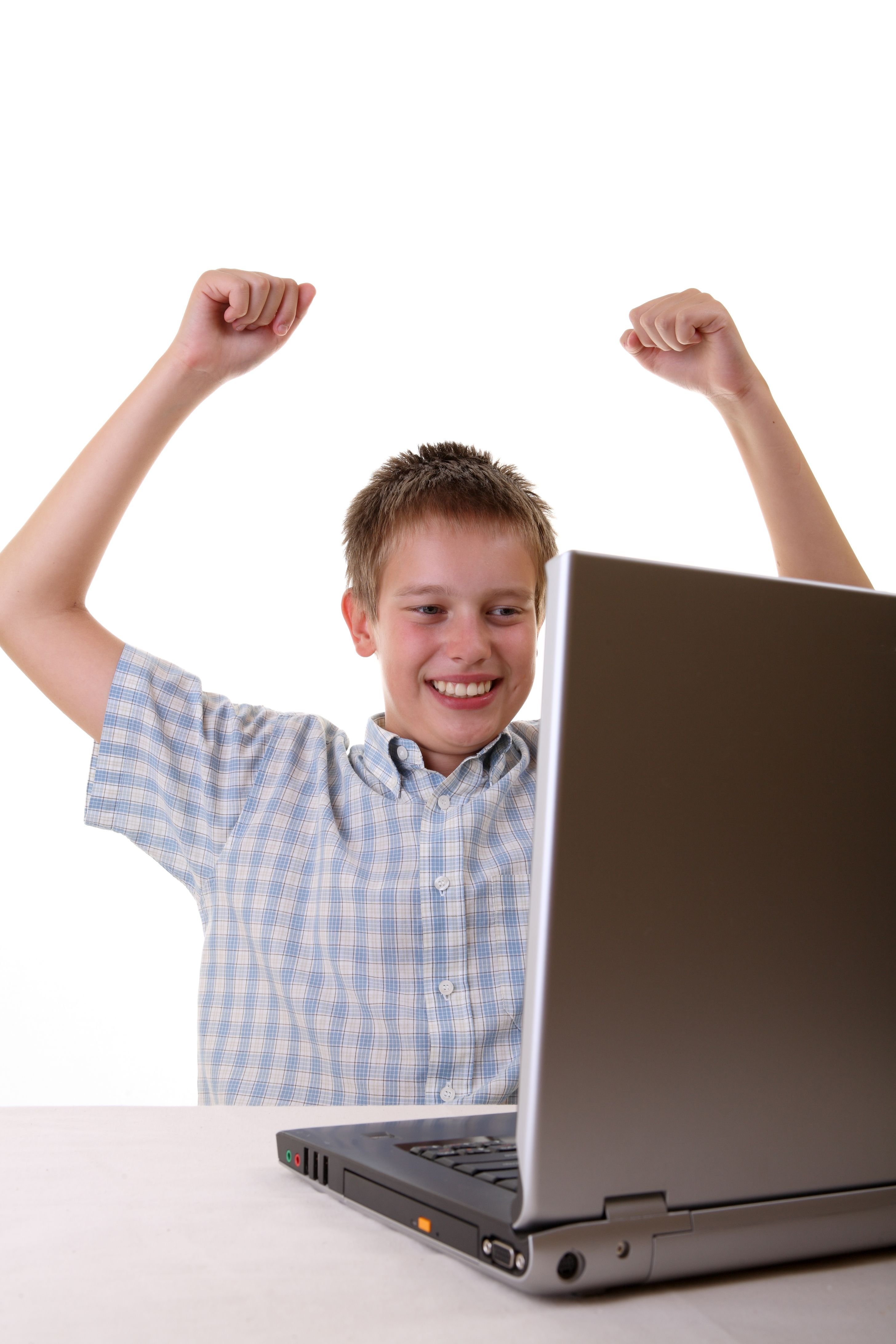 A young boy in front of a laptop. | Source: Shutterstock