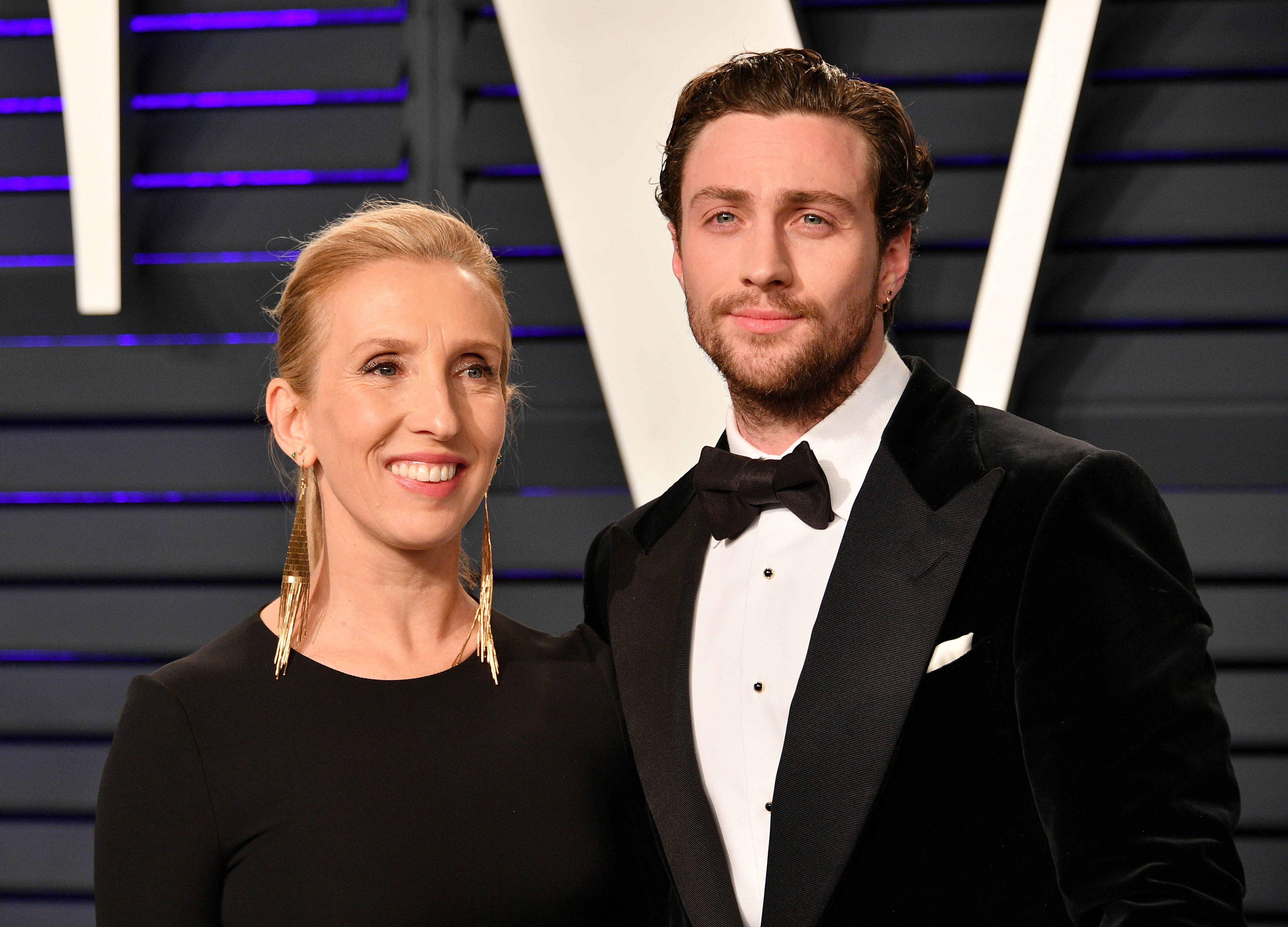 Sam Taylor-Johnson (L) and Aaron Taylor-Johnson attend the 2019 Vanity Fair Oscar Party hosted by Radhika Jones at Wallis Annenberg Center for the Performing Arts on February 24, 2019 in Beverly Hills, California. | Source: Getty Images
