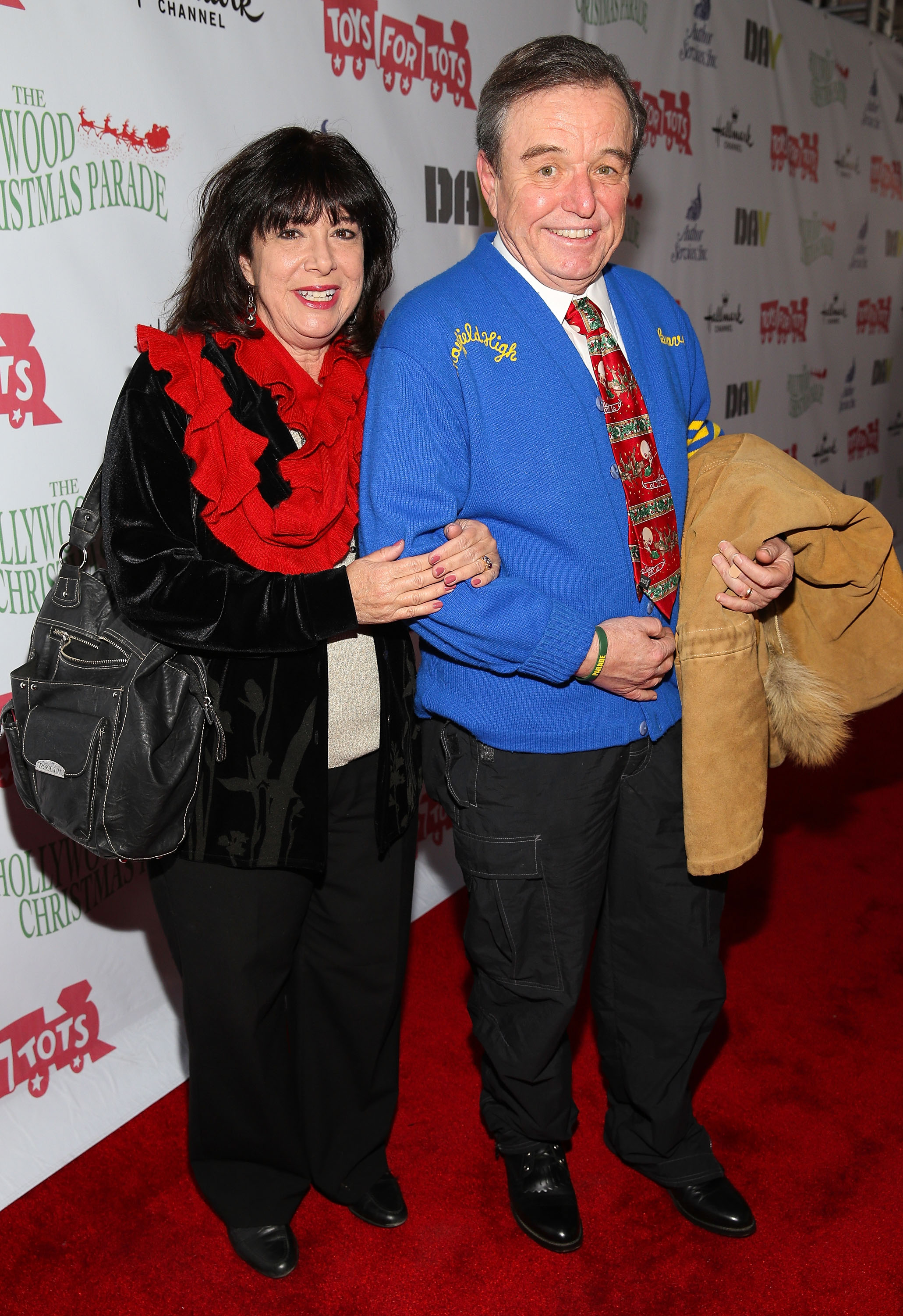 Teresa Modnick and Jerry Mathers at The Hollywood Christmas Parade benefiting the Toys For Tots Foundation in Hollywood, 2013 | Source: Getty Images