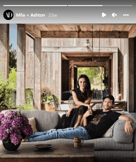 Couple Mila Kunis and Ashton Kutcher seated on a couch in their LA home. | Photo: Instagram/archdigest