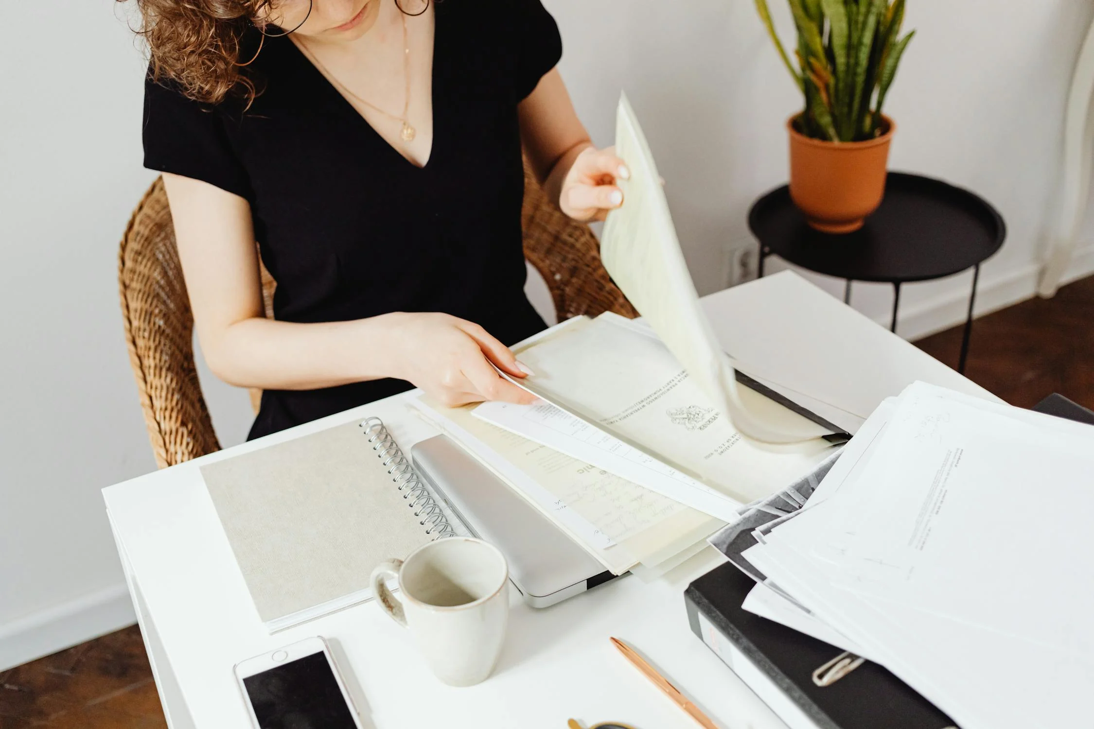 A woman looking through documents | Source: Pexels