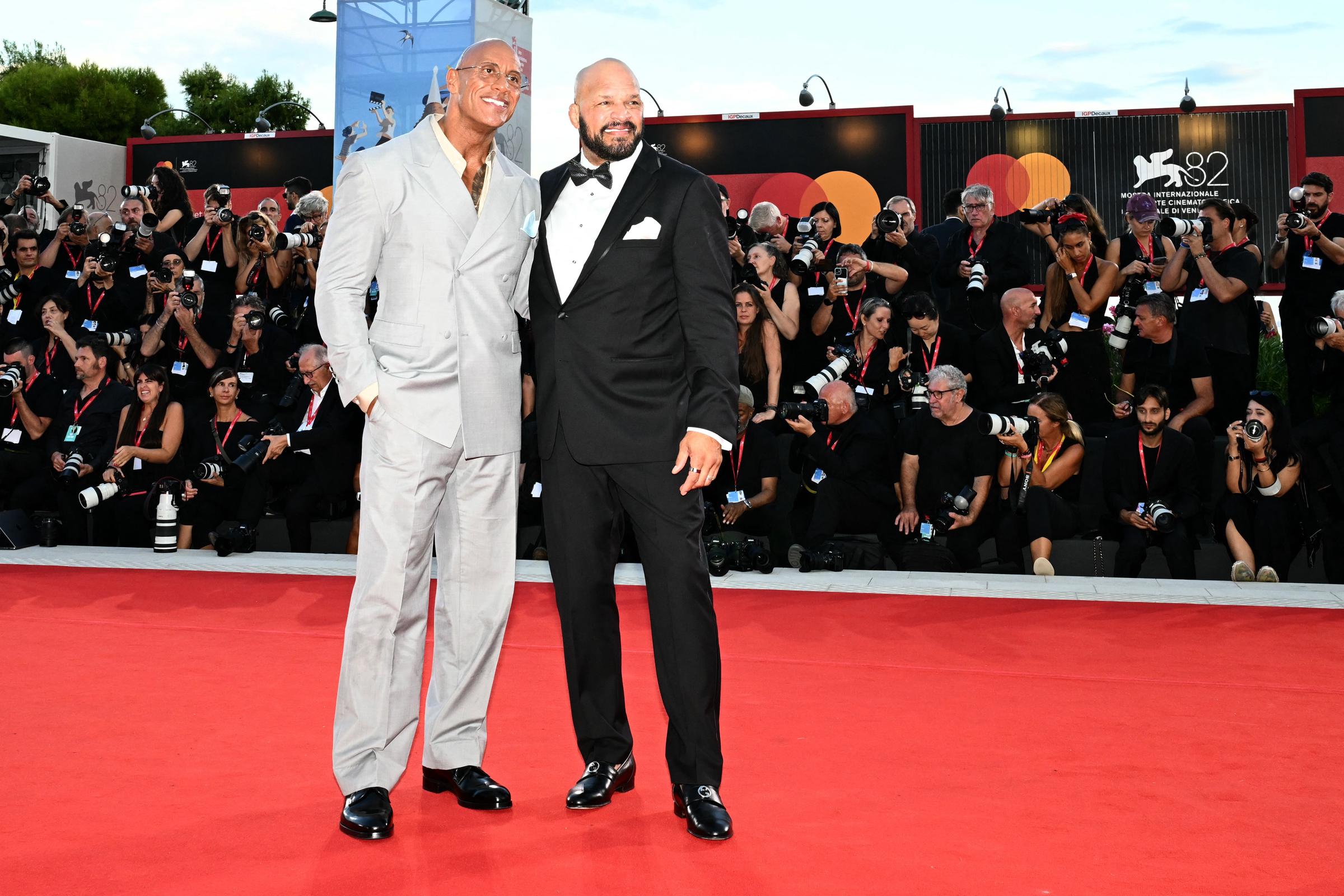 Dwayne Johnson and US former UFC fighter Mark Kerr attend the red carpet of the movie "The Smashing Machine" presented in competition at the 82nd International Venice Film Festival, at Venice Lido on September 1, 2025. | Source: Getty Images
