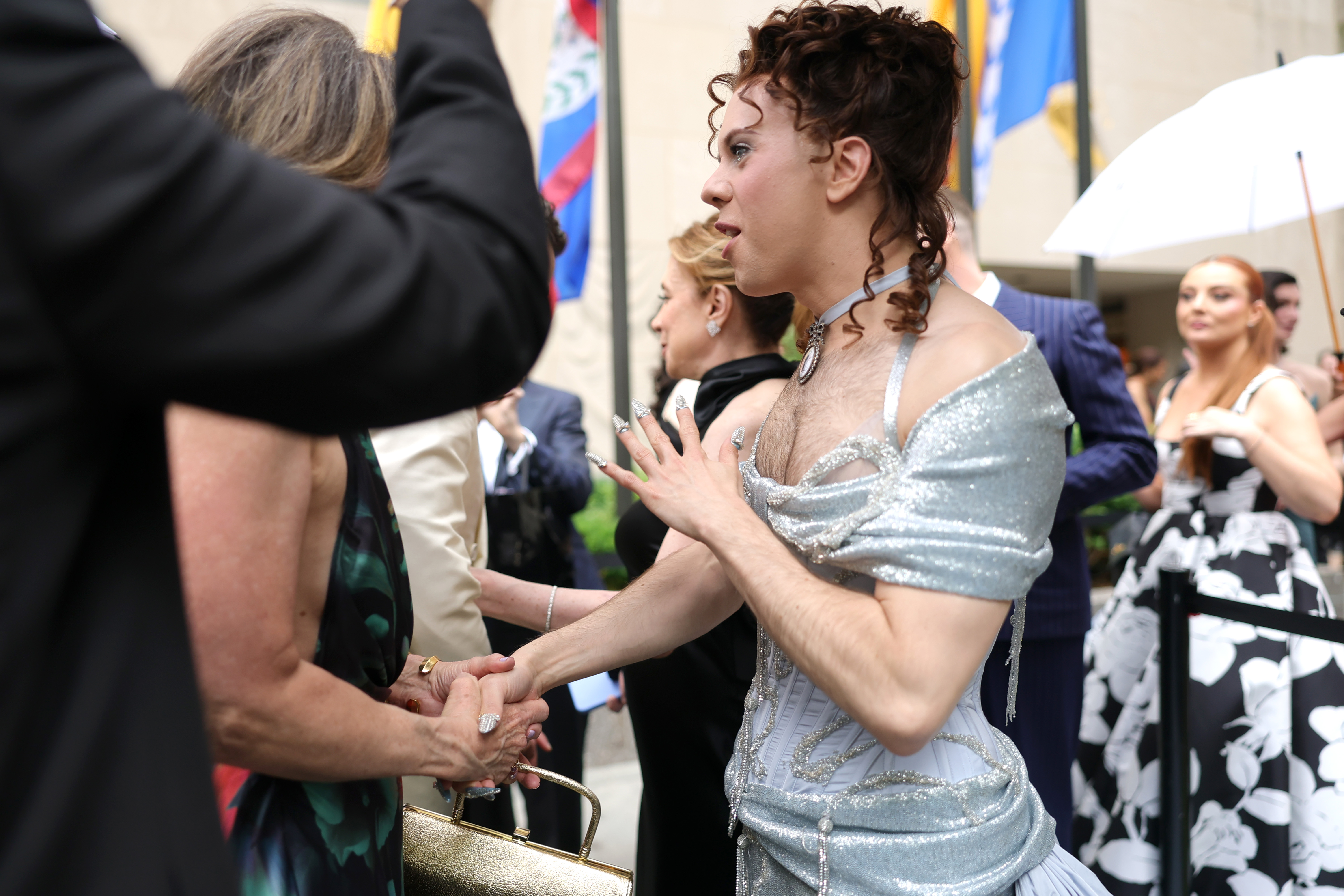 Cole Escola shaking hands with someone in the crowd as they arrive at the 78th Annual Tony Awards in New York City on June 8, 2025.