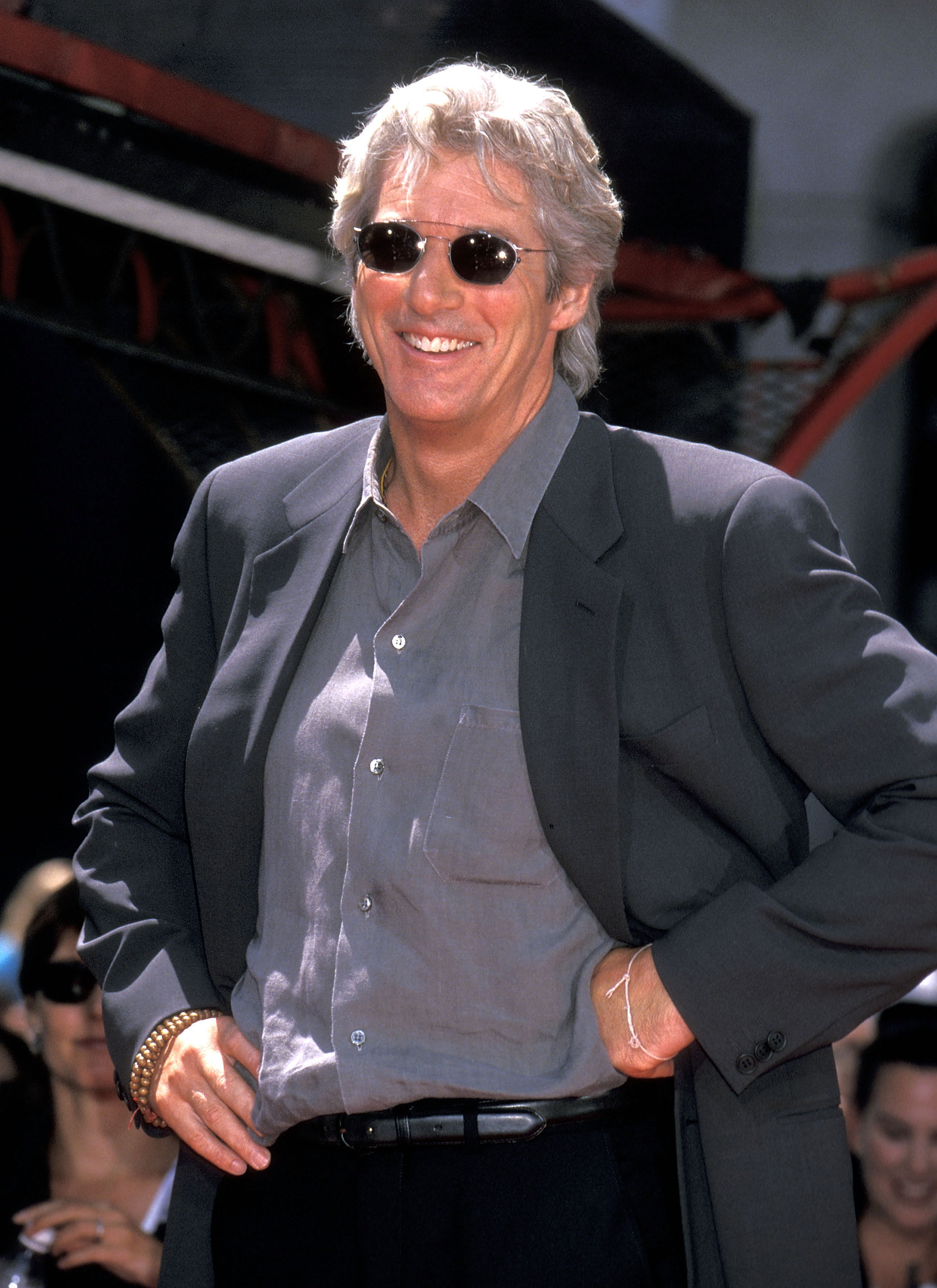 Richard Gere places his hands and feet into cement on July 26, 1999 at Manns Chinese Theatre in Hollywood, California. | Source: Getty Images