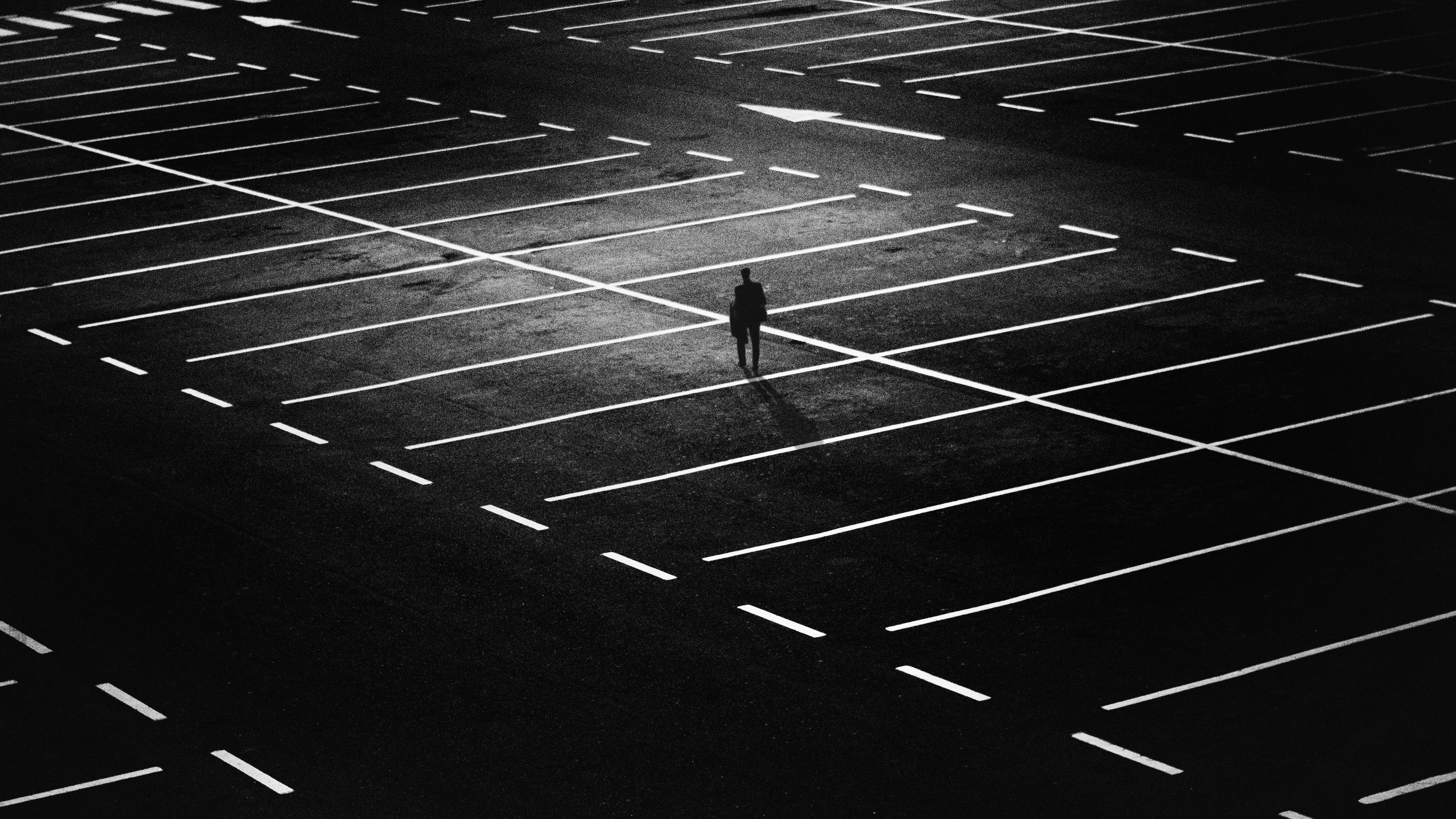 Pictured - A man standing on an empty parking lot | Source: Pexles 
